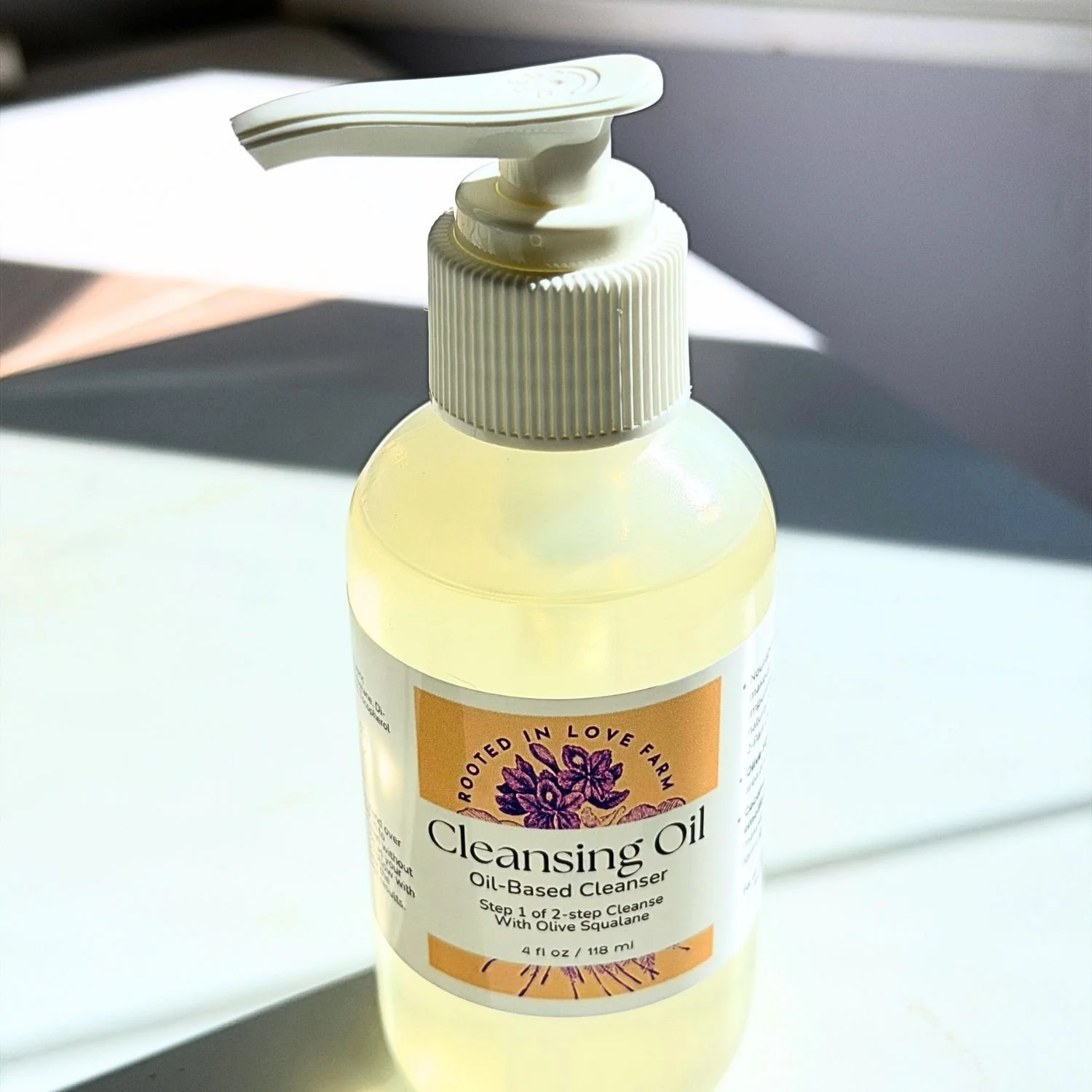 Cleansing Oil close up top pump view with clean background.jpg