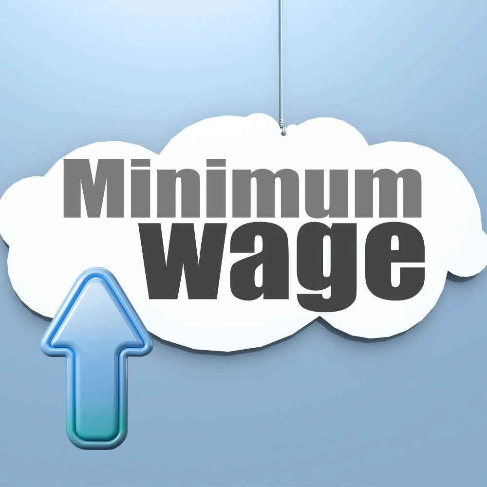Salary Benchmarking - 'Minimum Wage' written on a cloud with a blue arrow pointing upwards