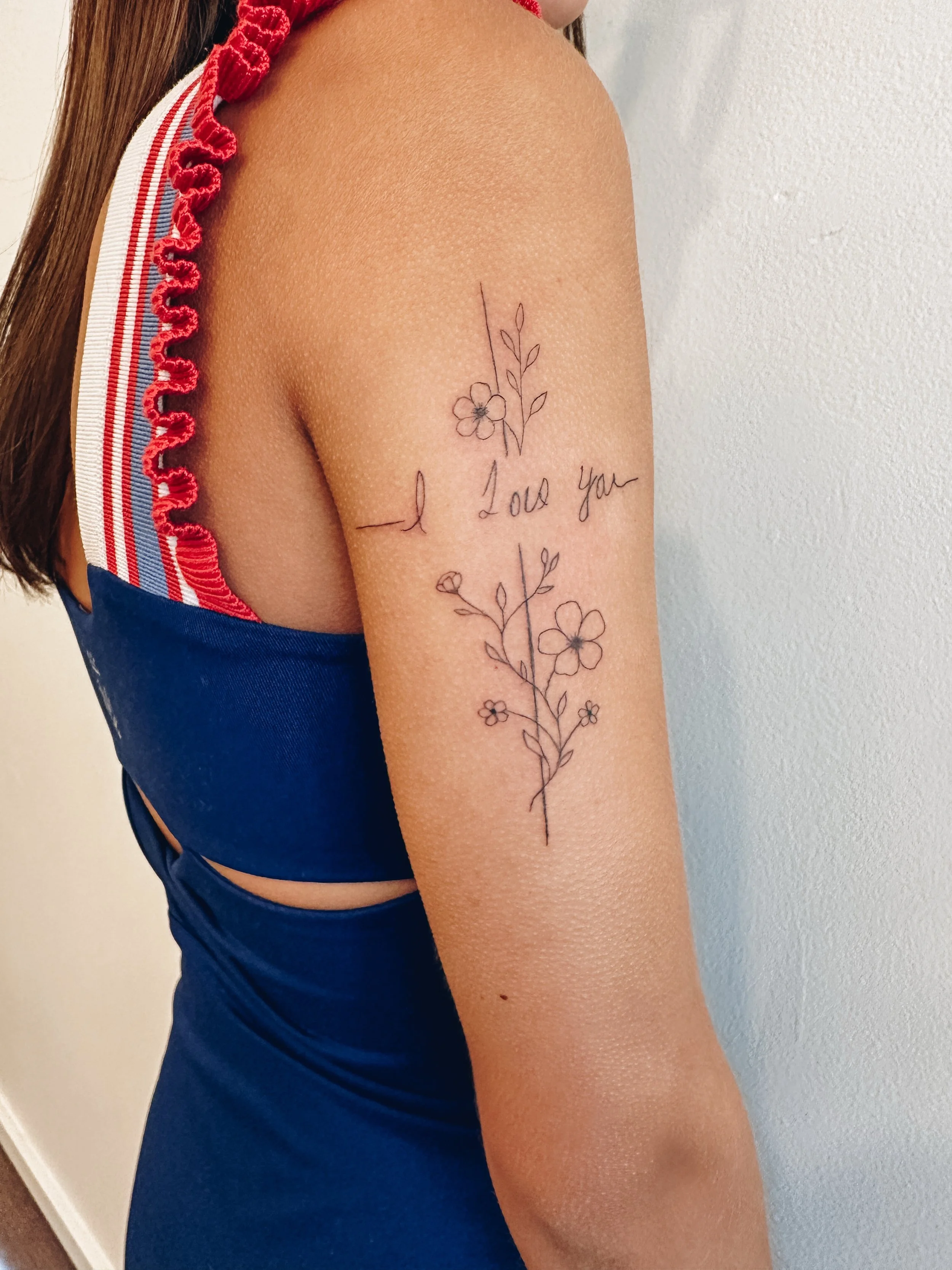 Some tattoos are beautiful.
Some tell a story.
And some become a way to carry someone with you forever.

This floral cross was created using my client&rsquo;s dad&rsquo;s handwriting, making it a deeply personal tribute filled with love, faith, and m
