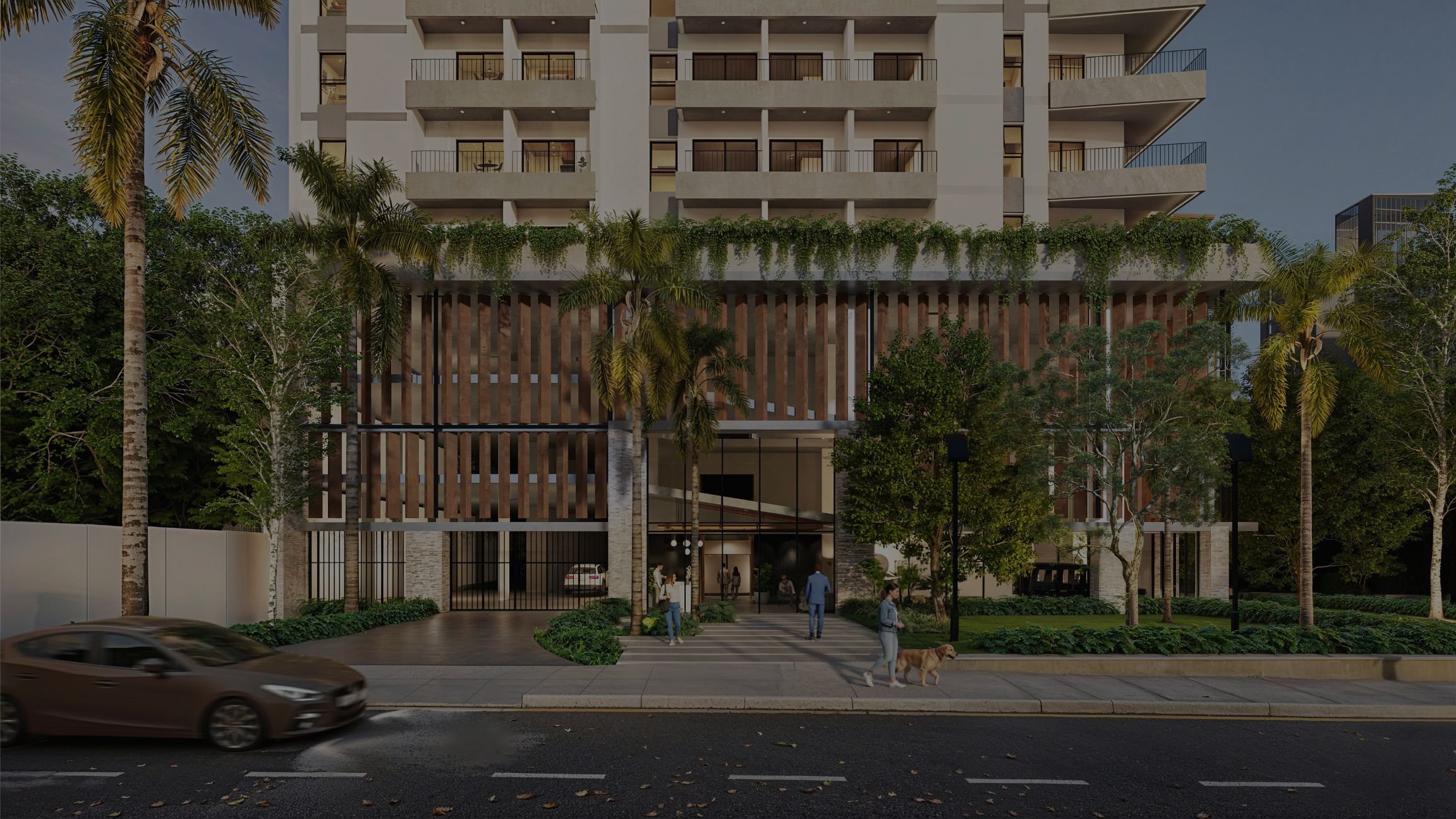 Exterior view of a contemporary residential building in Villa Morra, Asunción, Paraguay, surrounded by trees and landscaped greenery.