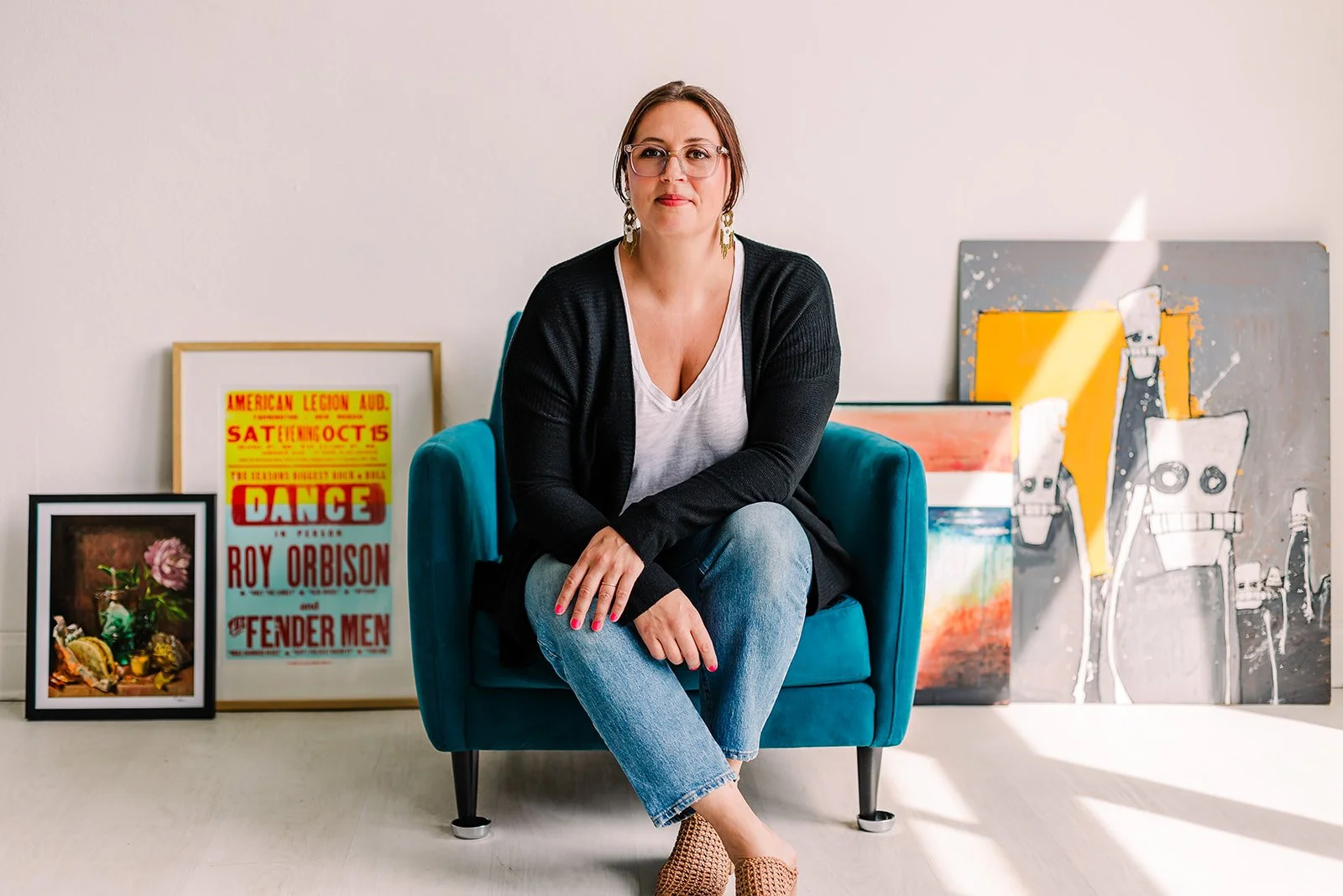 Cassandra McGrath, creative leader, sitting in gallery chair