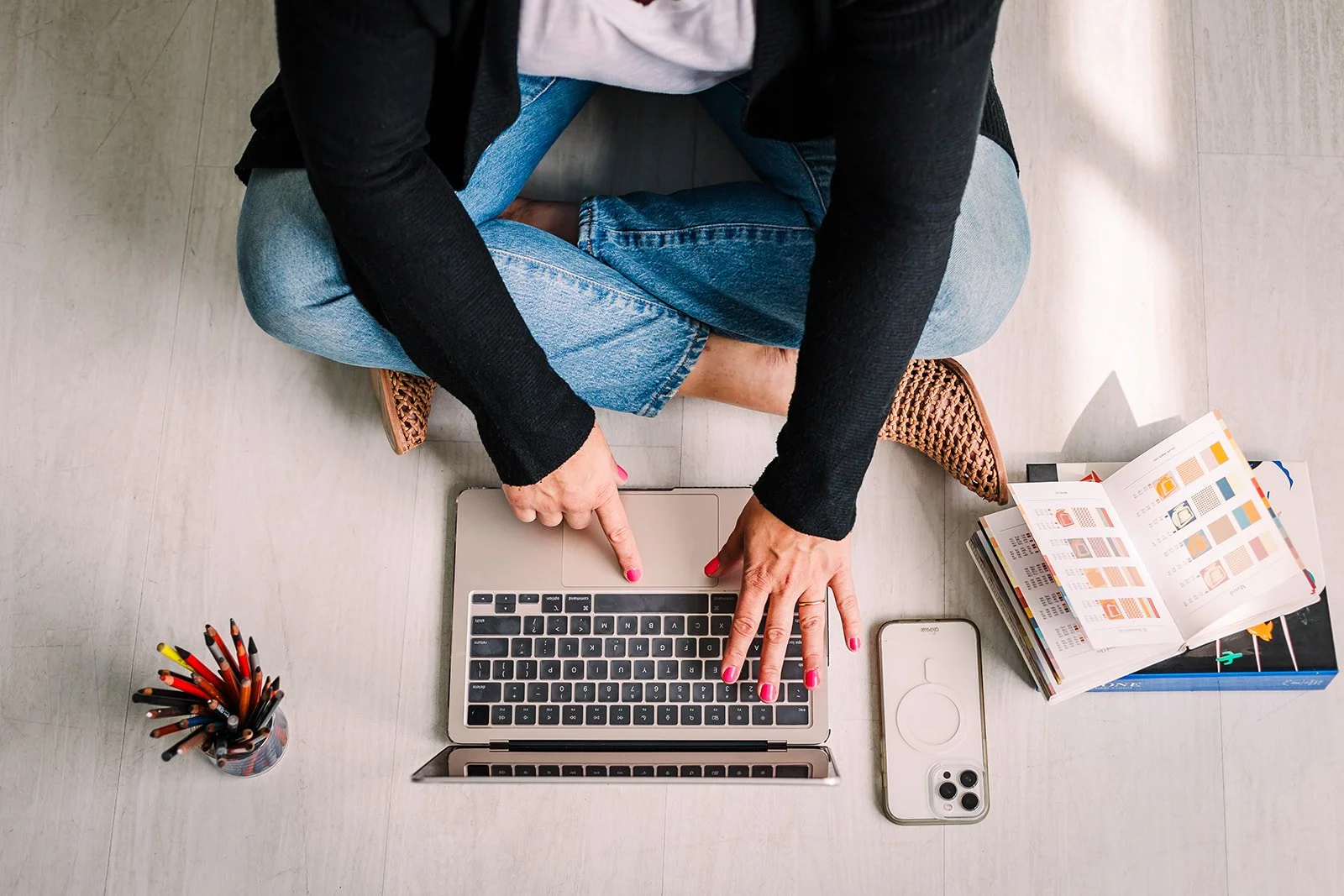 Cassandra McGrath, creative leader, working at her computer