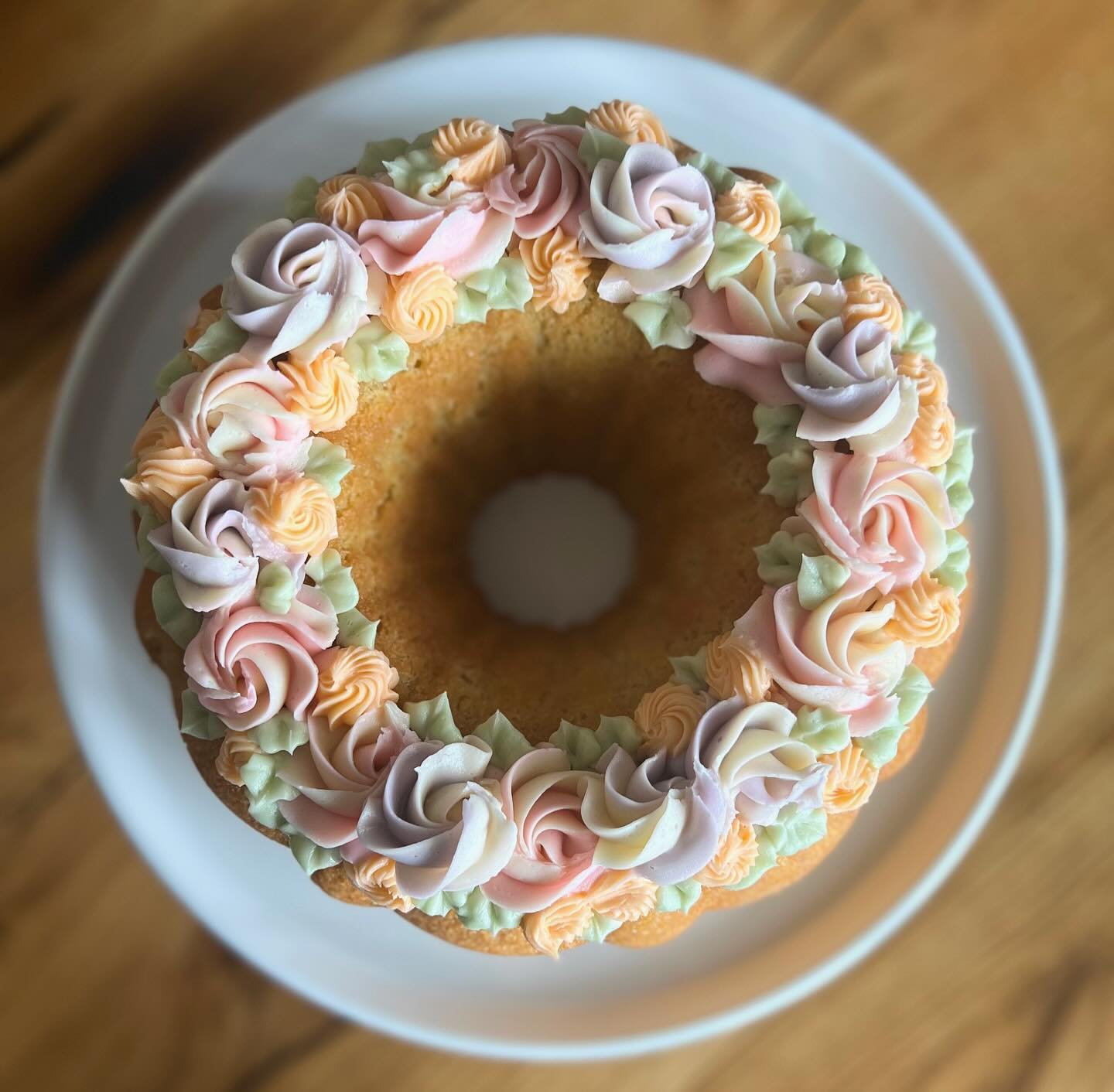 ✨Circle of Life Bundt Cake✨
.
.
Another item available for Mother&rsquo;s Day preorder! Rich traditional pound cake crowned with pastel buttercream roses. 🌹
.
.
#cakedecorating #buttercream #frosting #poundcake #bakery #yum #treatyourself
