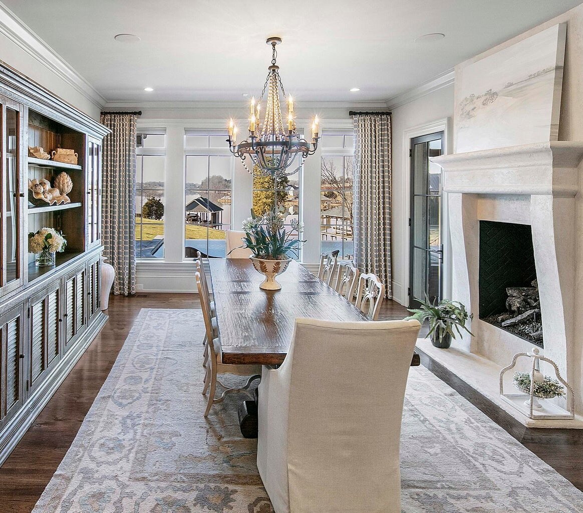 Dining with a view. This elegant dining space offers a mixture of formal and casual flanked by a limestone fireplace.