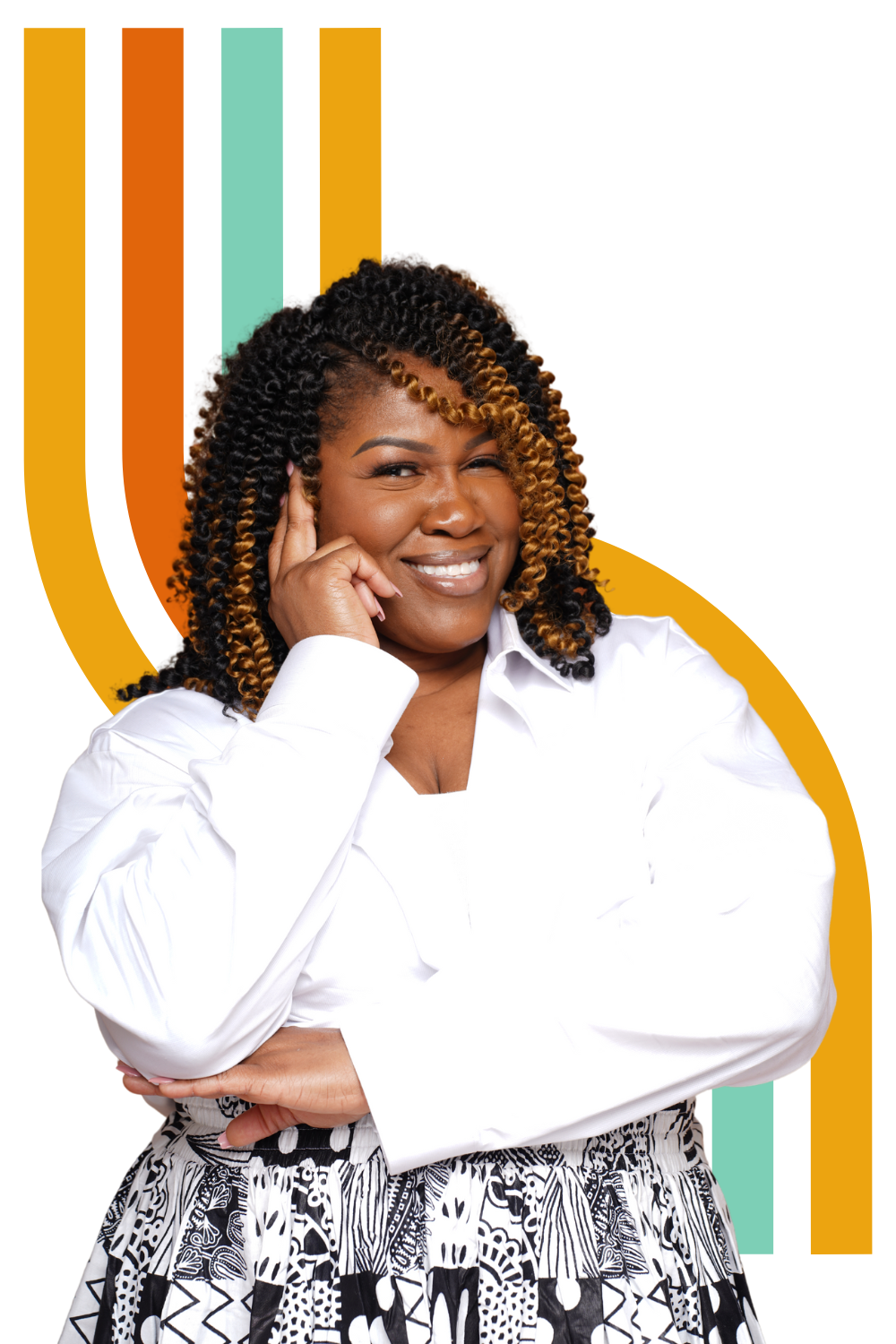 A woman with curly, highlighted hair smiling while resting her chin on her hand, wearing a white blouse and a black and white patterned skirt, against a colorful, abstract background.