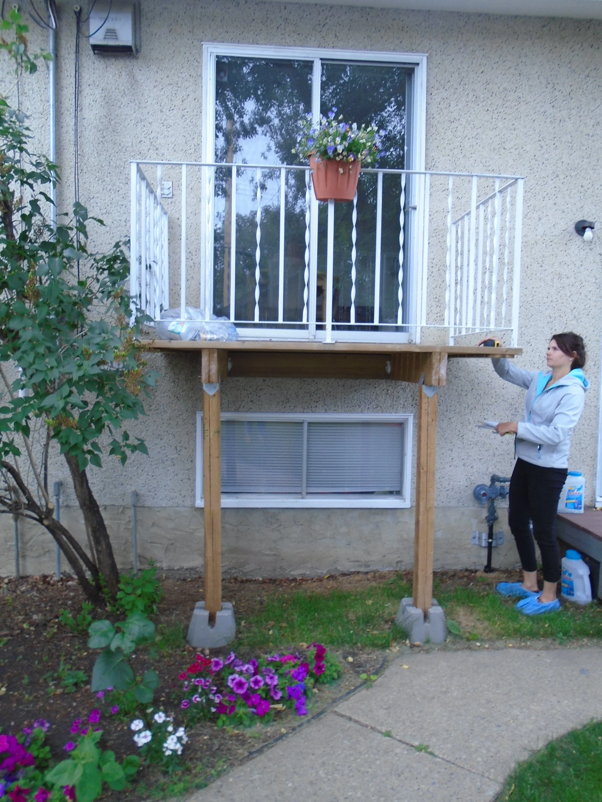 Rear, wood balcony with patio sliding door.