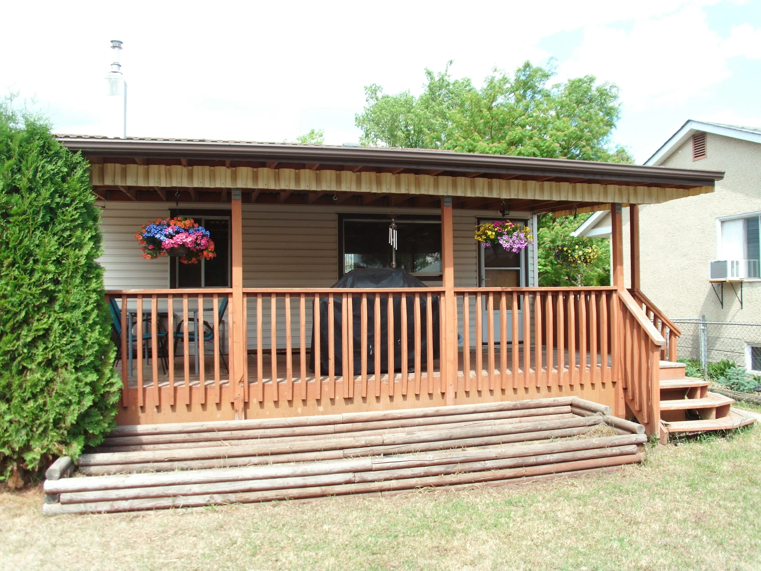 Rear covered deck requires development permit and building permit.