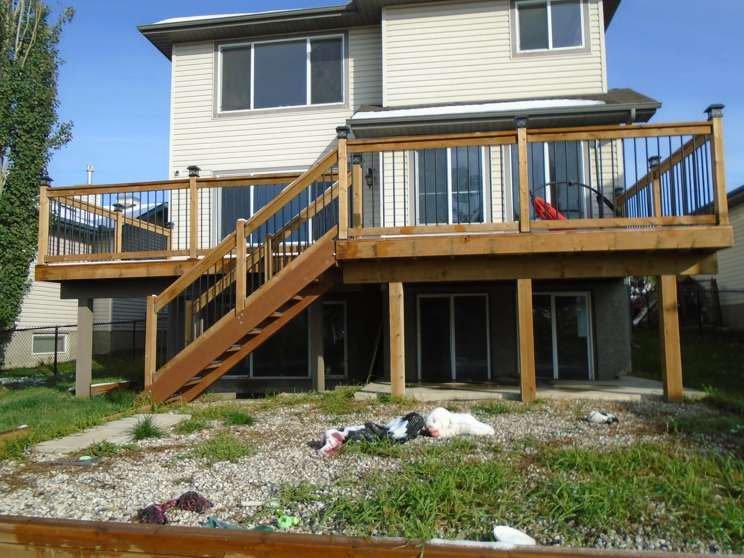 Rear, wood deck over a walk-out basement.