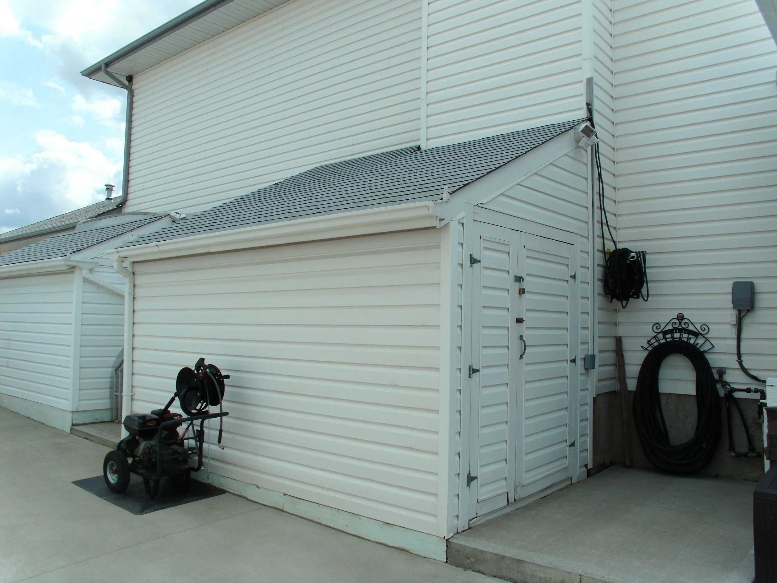Shed attached to house requires development permit and building permit.