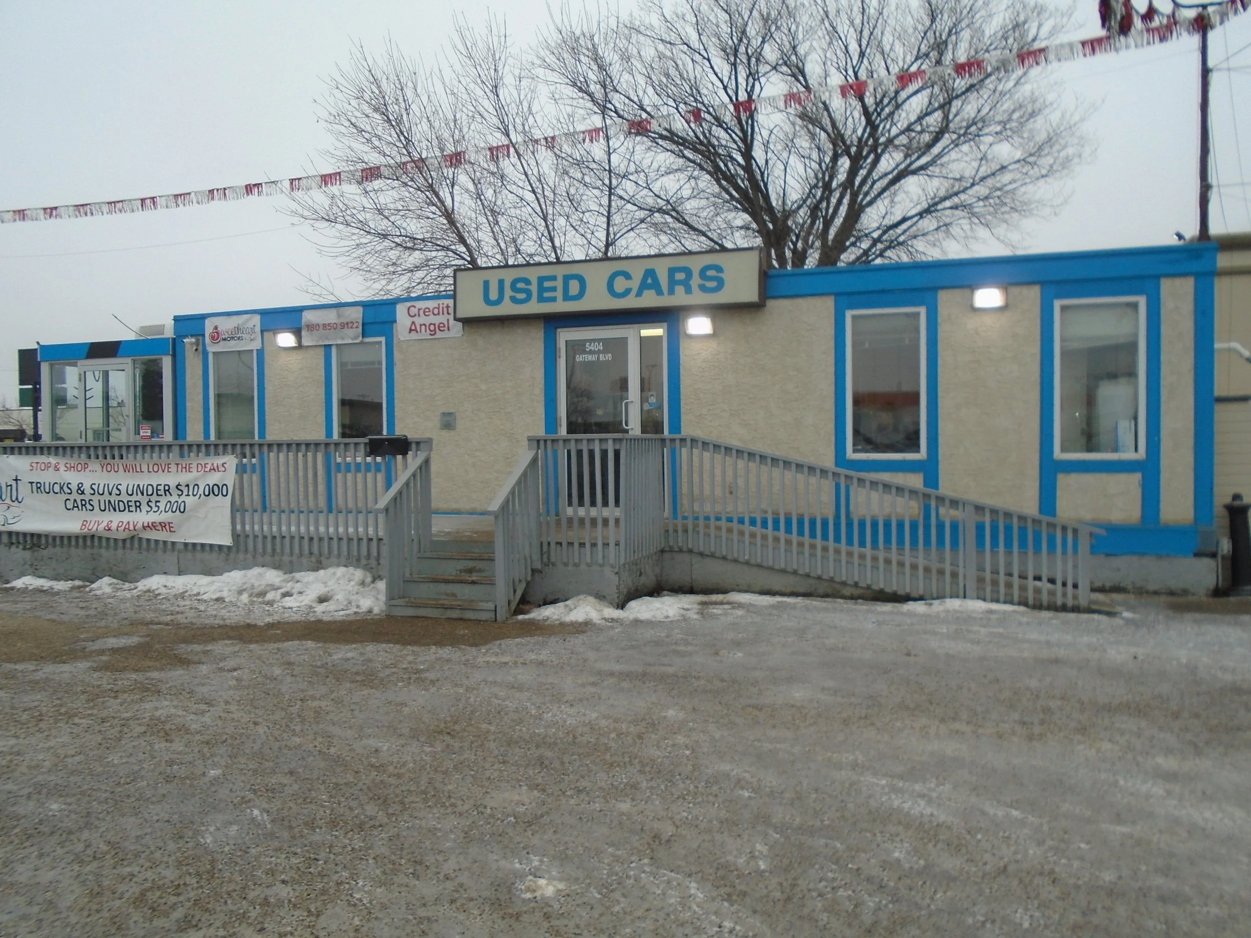 Mobile trailer with wheelchair accessible ramp requires development permit and building permit.