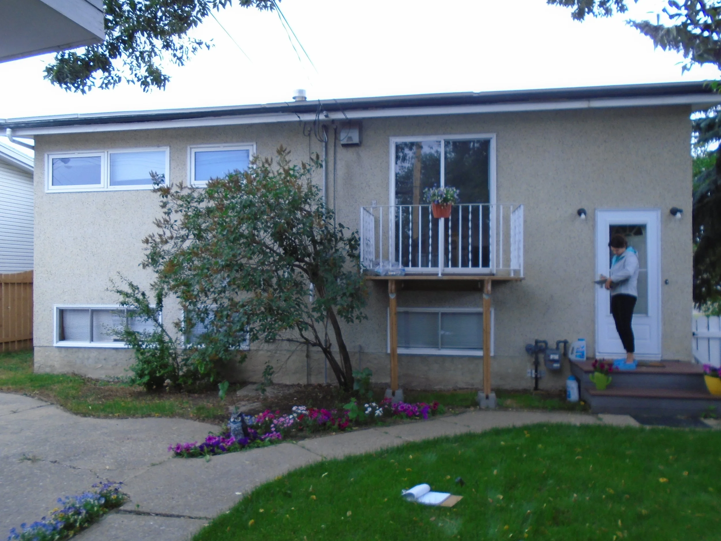 Rear, wood balcony for patio sliding door.