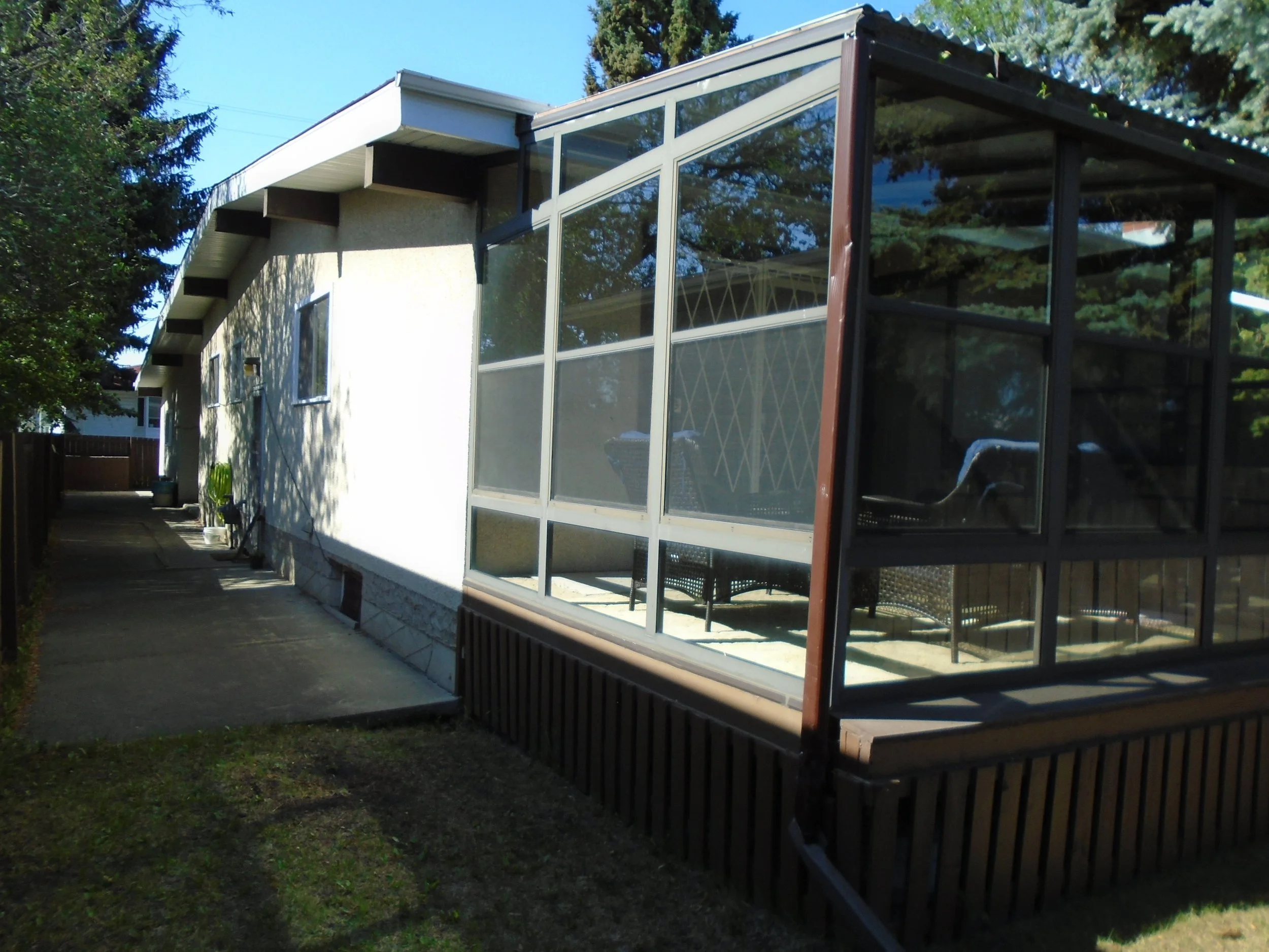 3 Season Sunroom with permanent foundation attached to the house.
