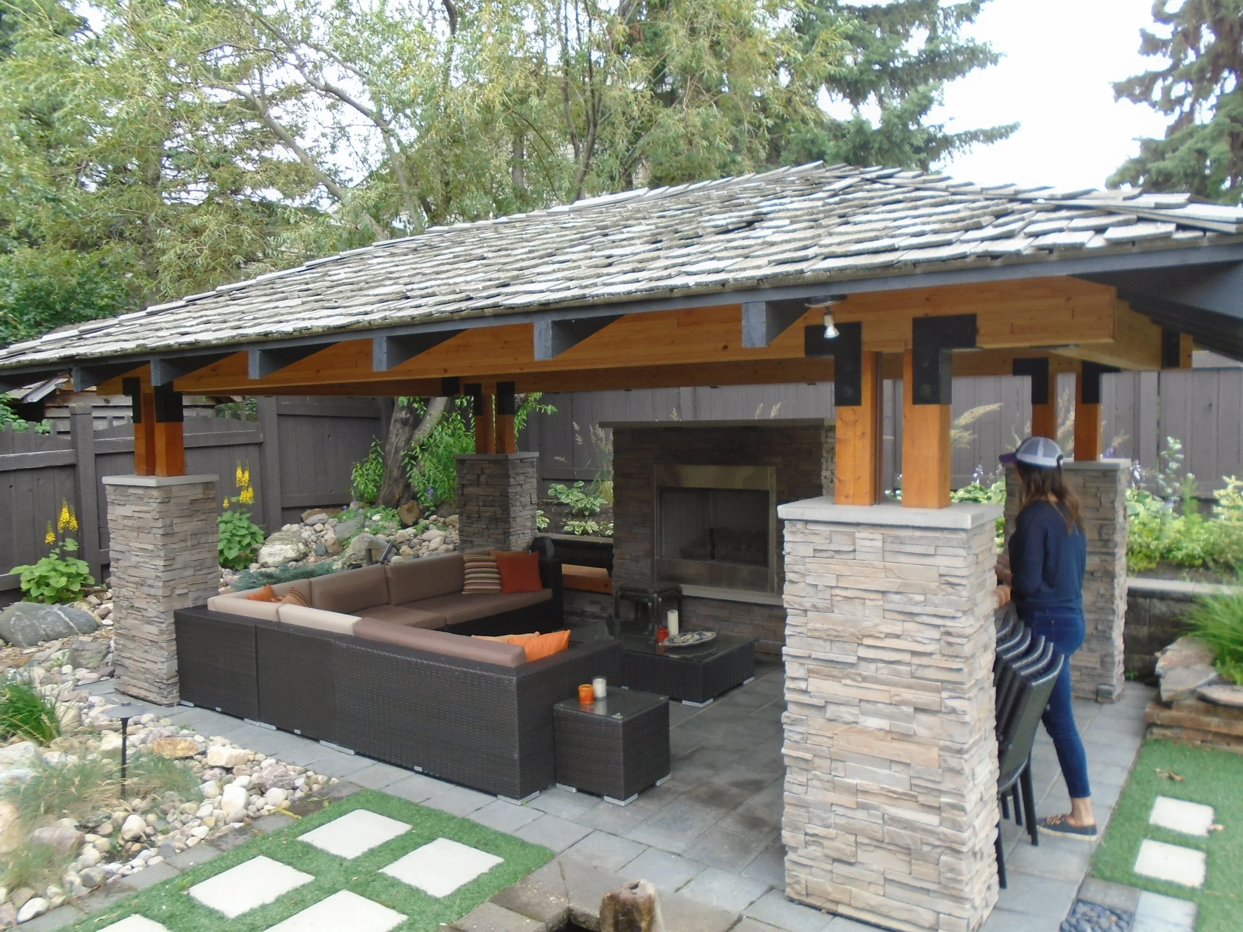 Custom wood gazebo with outdoor fireplace.