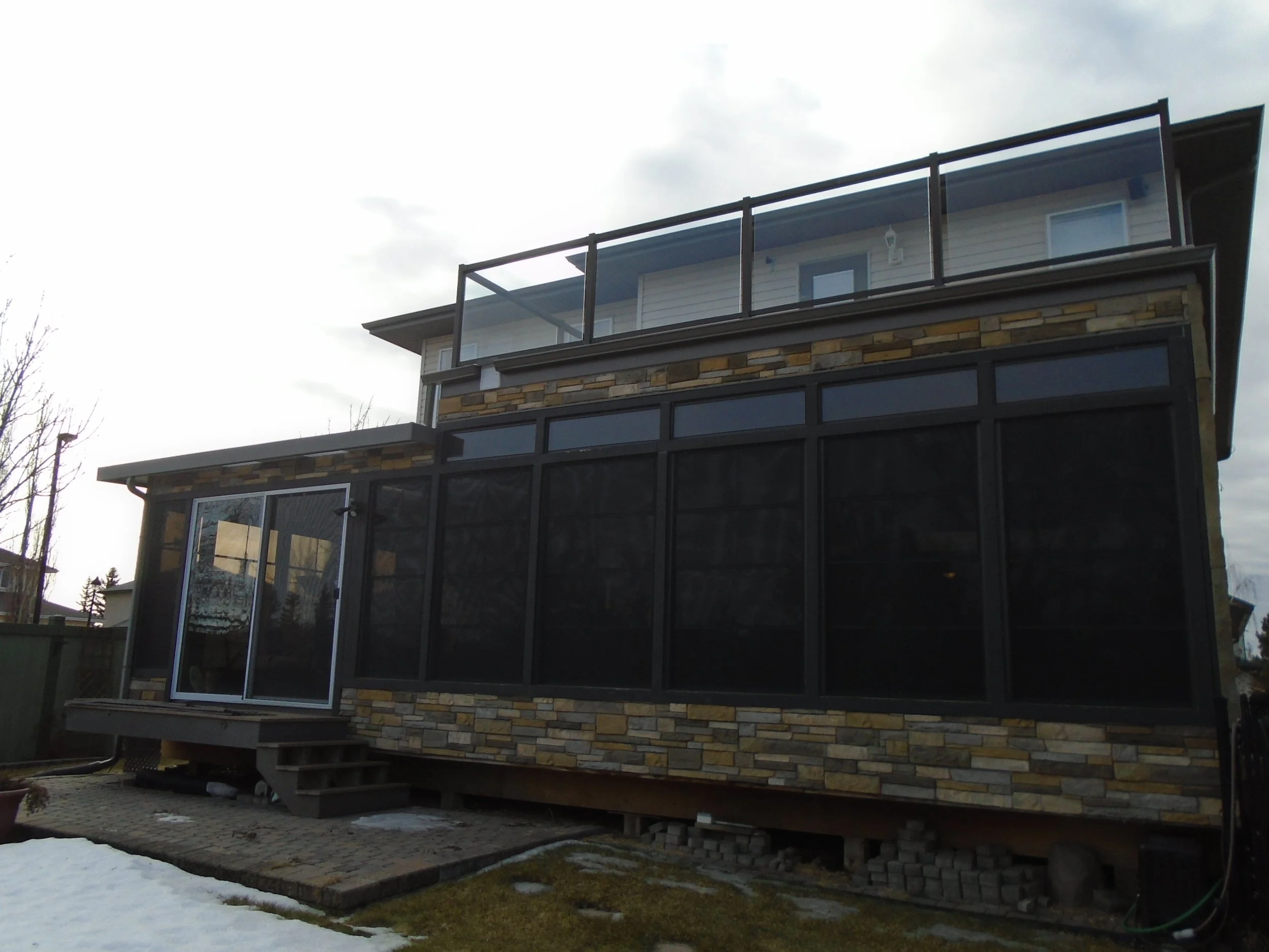 3 Season Sunroom with permanent foundation attached to the house.