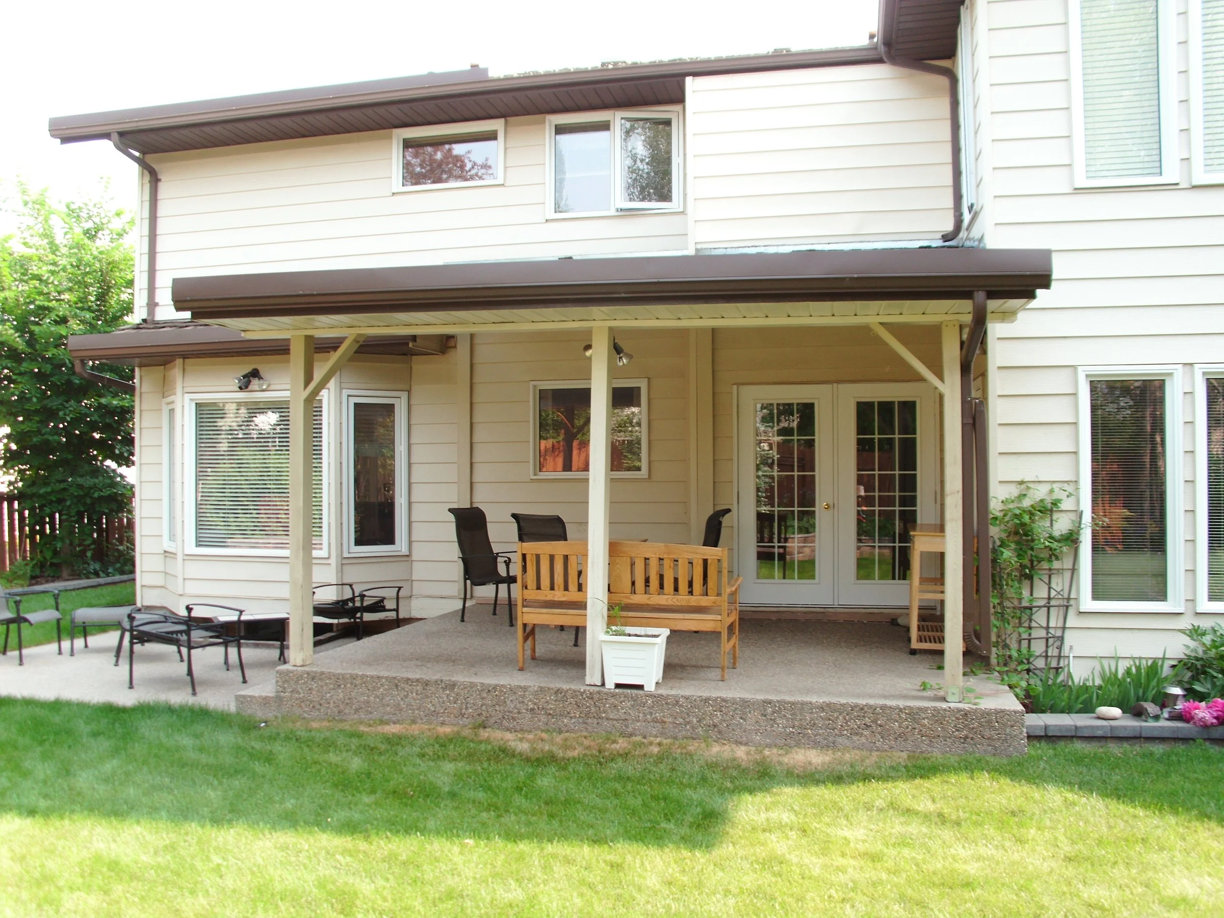 Rear covered deck requires development permit and building permit.