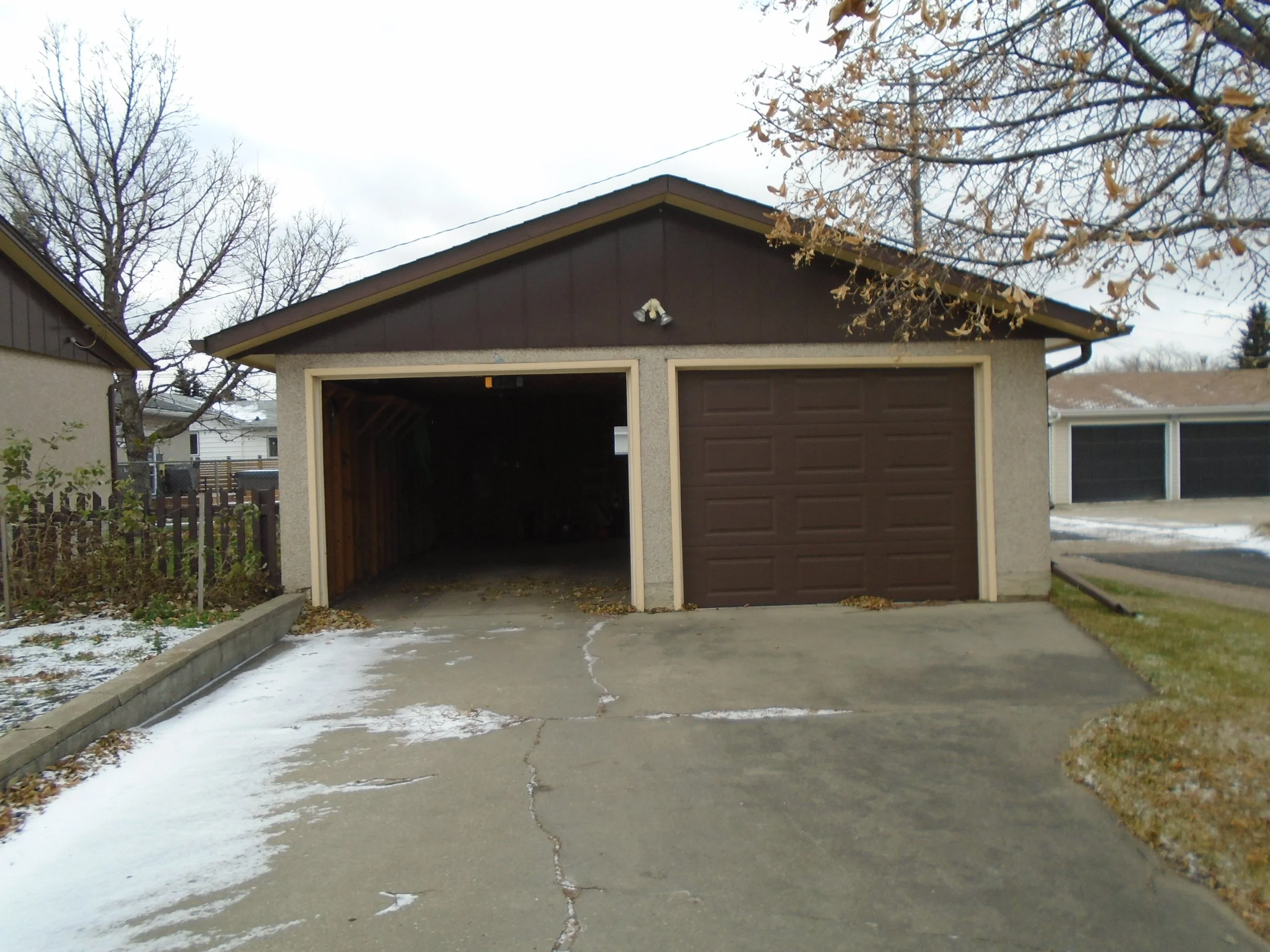 Rear, detached garage requires development permit and building permit.