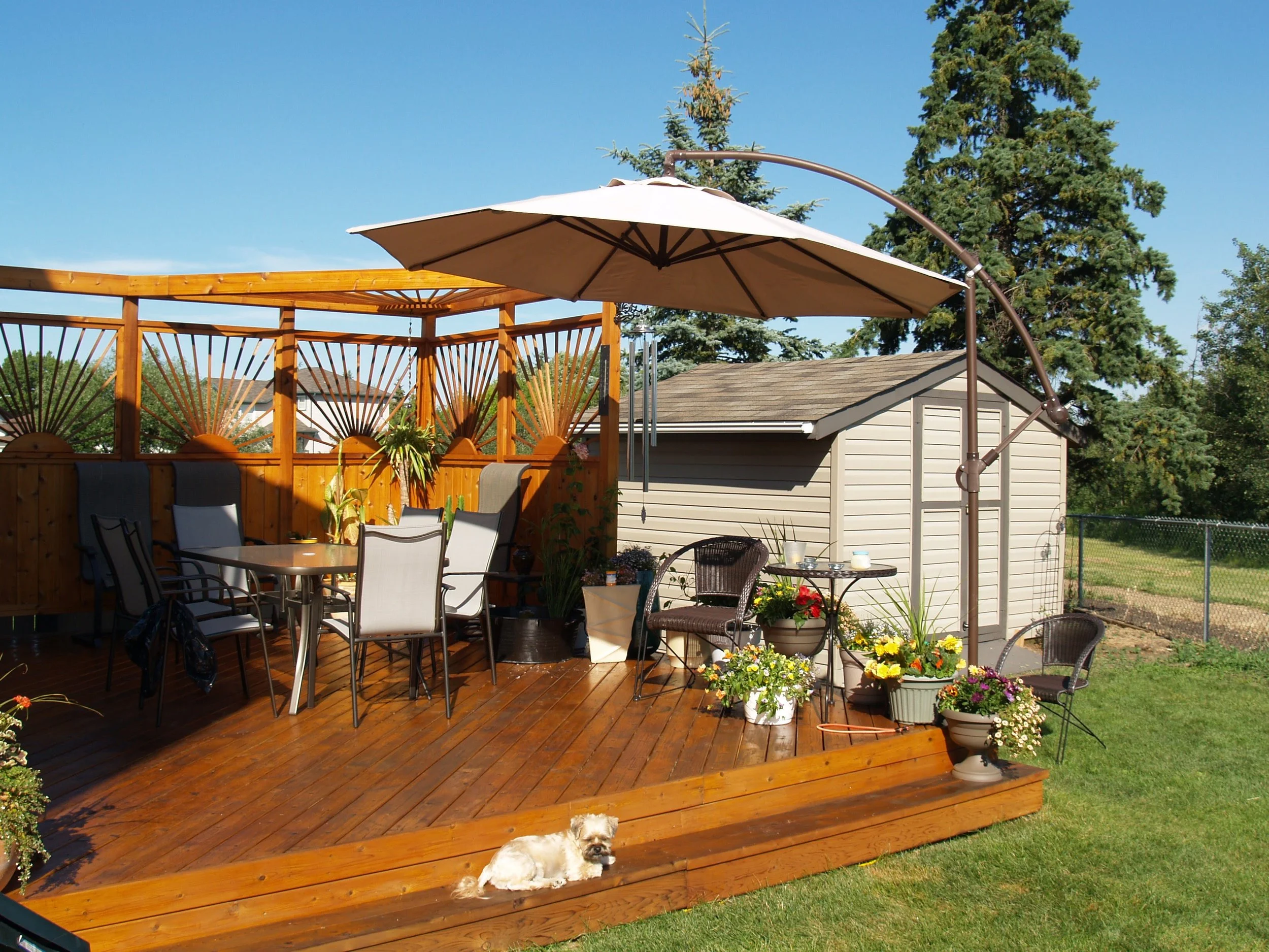 Rear wood patio with over height privacy screen.