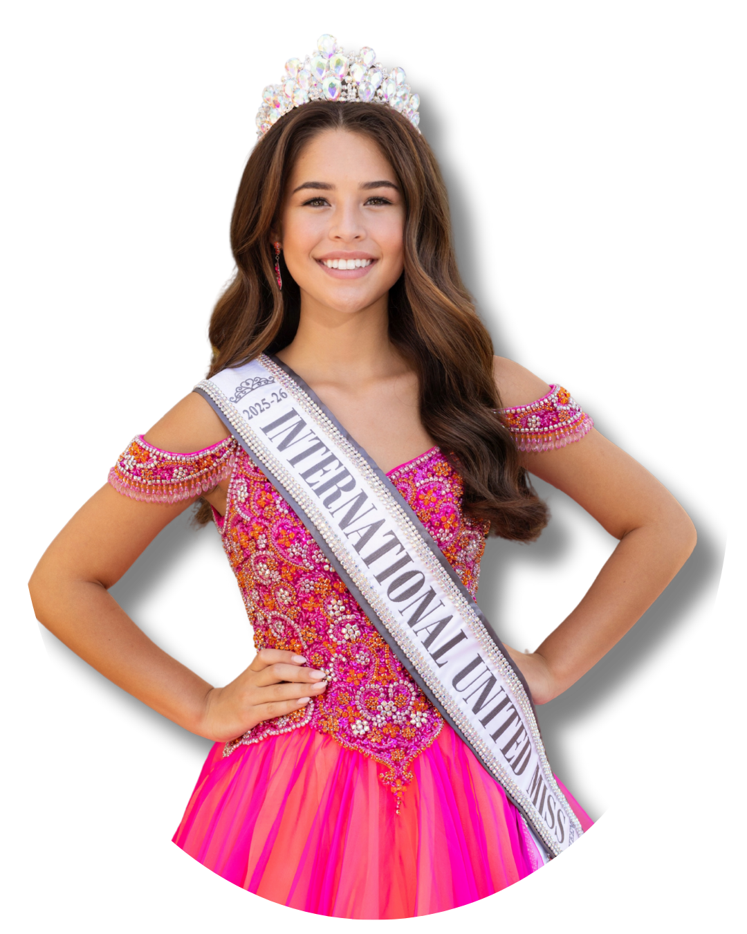 Young woman wearing a pink gown and tiara with a sash that reads 'International United Miss'.