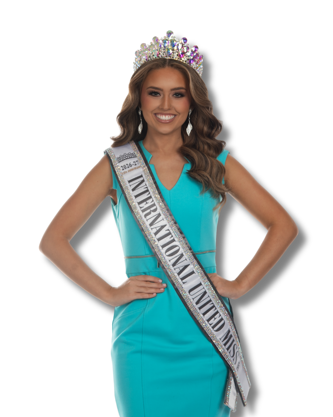 A young woman wearing a tiara, sash, and a pink gown with intricate beadwork, smiling confidently with one hand on her hip, against a black background.