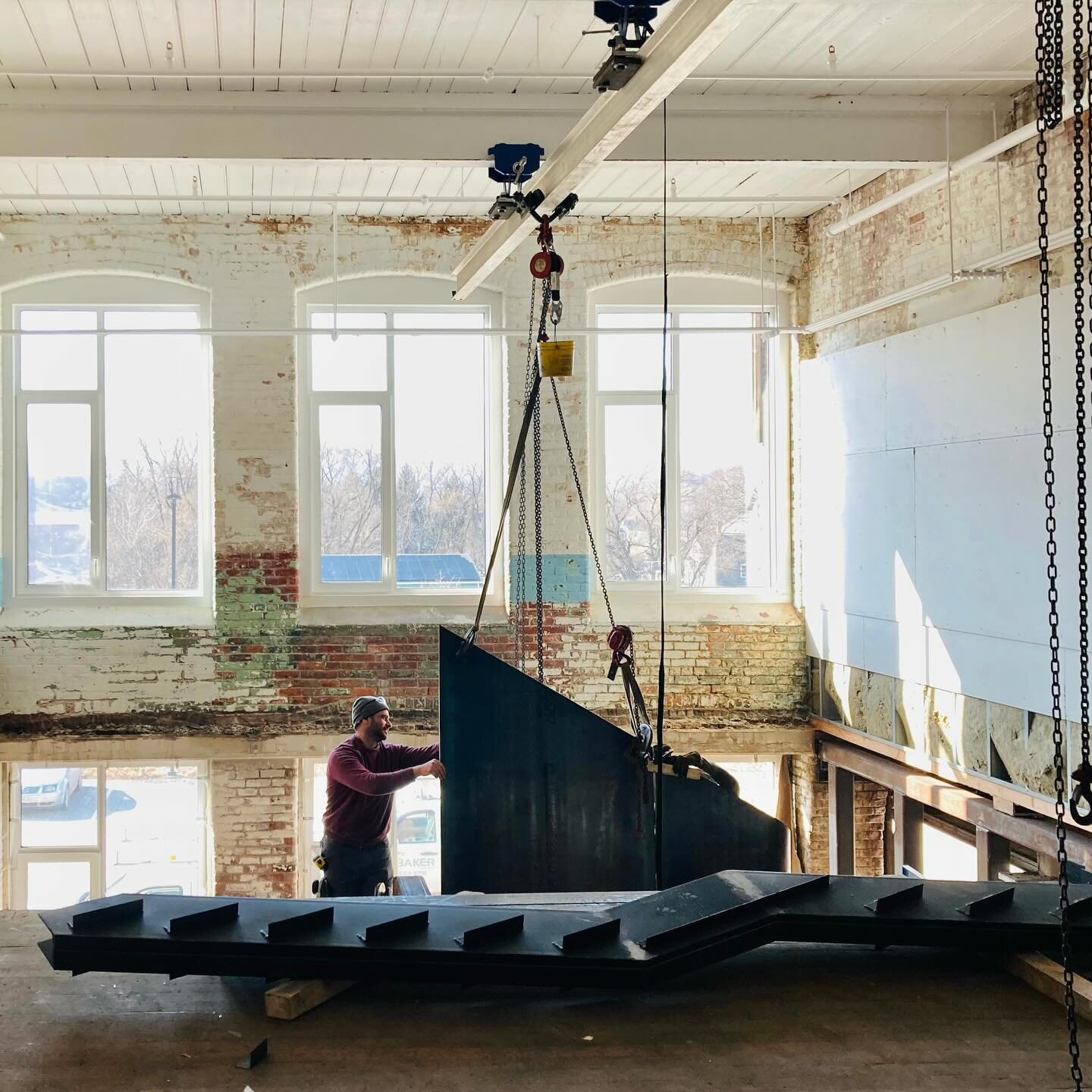 That rolled 1/2&ldquo; thick steel plate from the previous post has been incrementally hoisted and welded to form the structure of a lovely stair now ascending in the double-height lobby of the LOFTS @greylockWORKS. 

Photo 1 of and photo 2 by @subtl