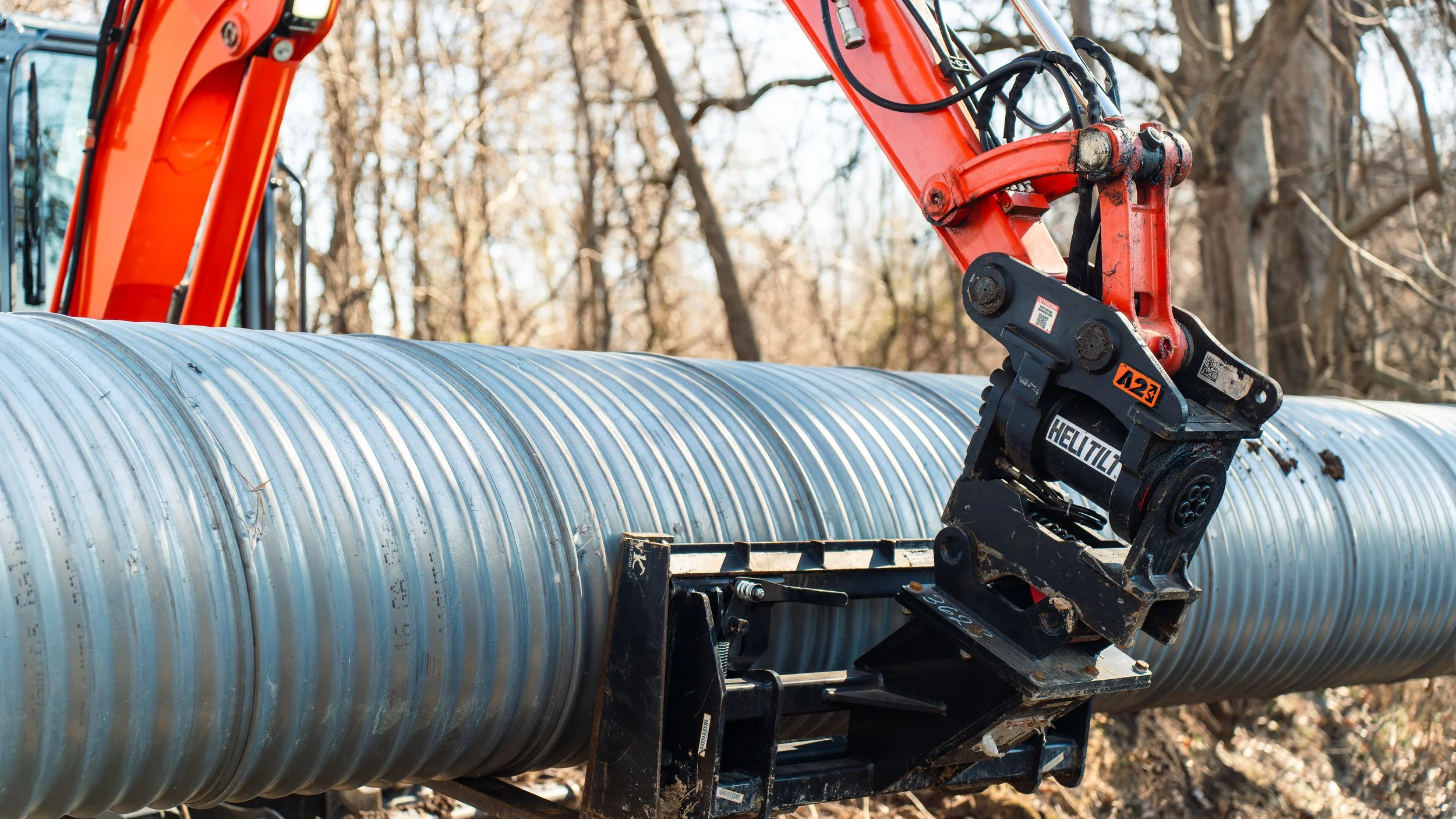 Excavator with tilt attachment