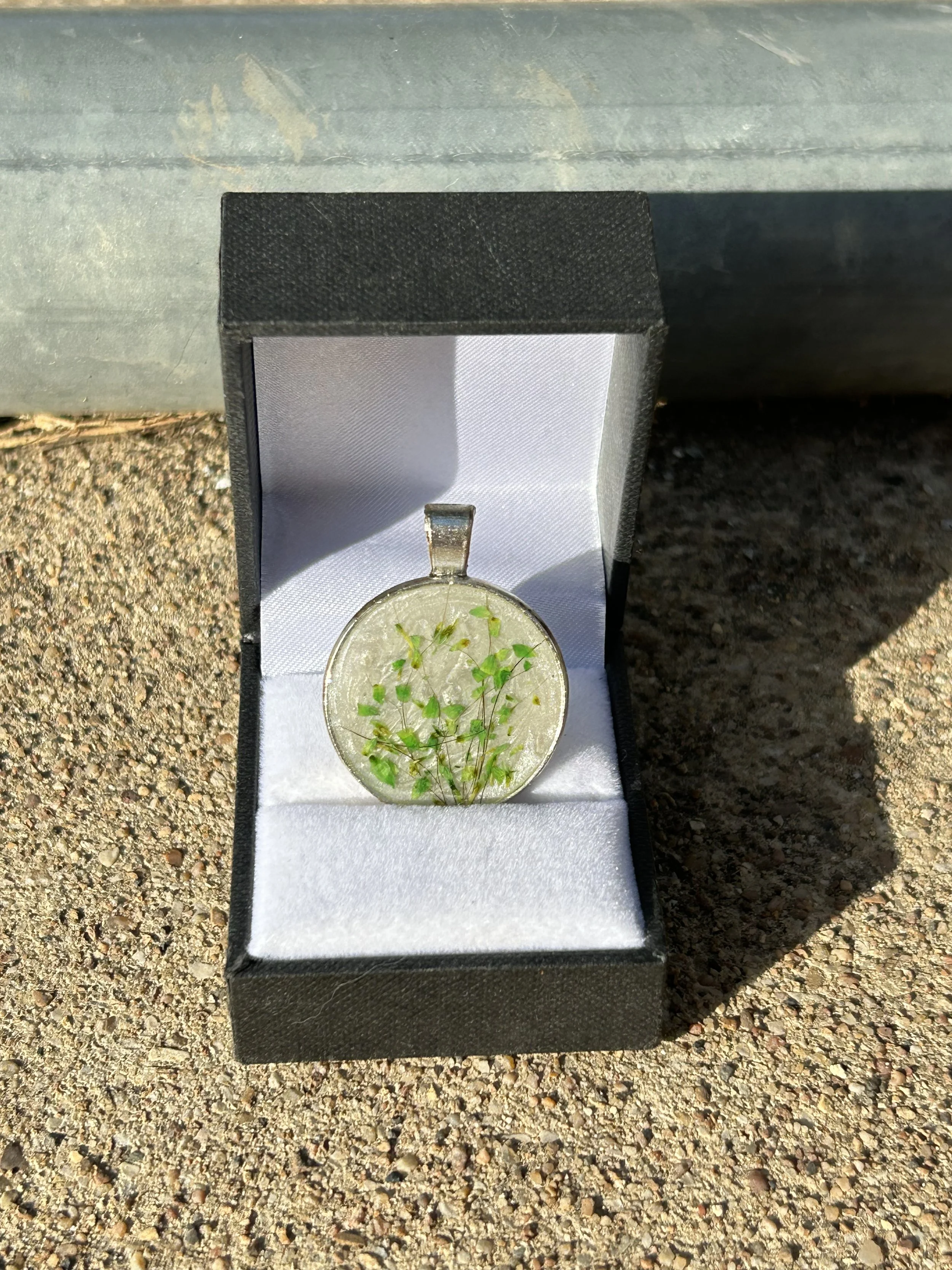 dog fur and green petals on top of ashes, this piece was made to look like ivy