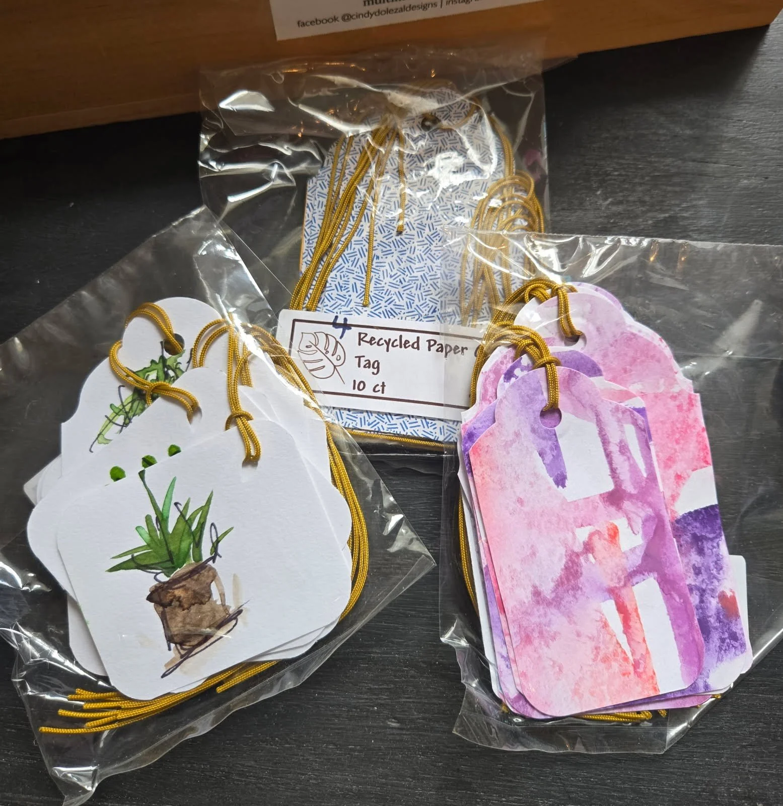 handpainted and upcycled tags by Cindy Dolezal