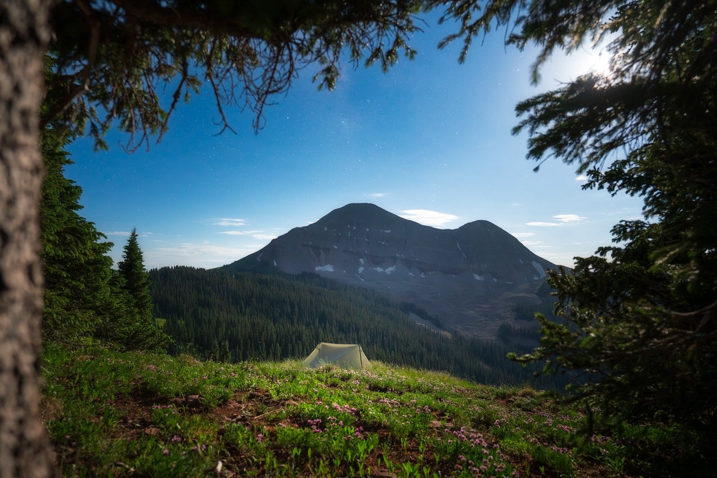 Sifting through my archives for a new blog post, I came across this forgotten image from a night in the San Juans. My @durstongear X-Mid sits quietly on a ridge, framed by the trees, with Engineer Mountain and its rock glacier looming in the moonligh