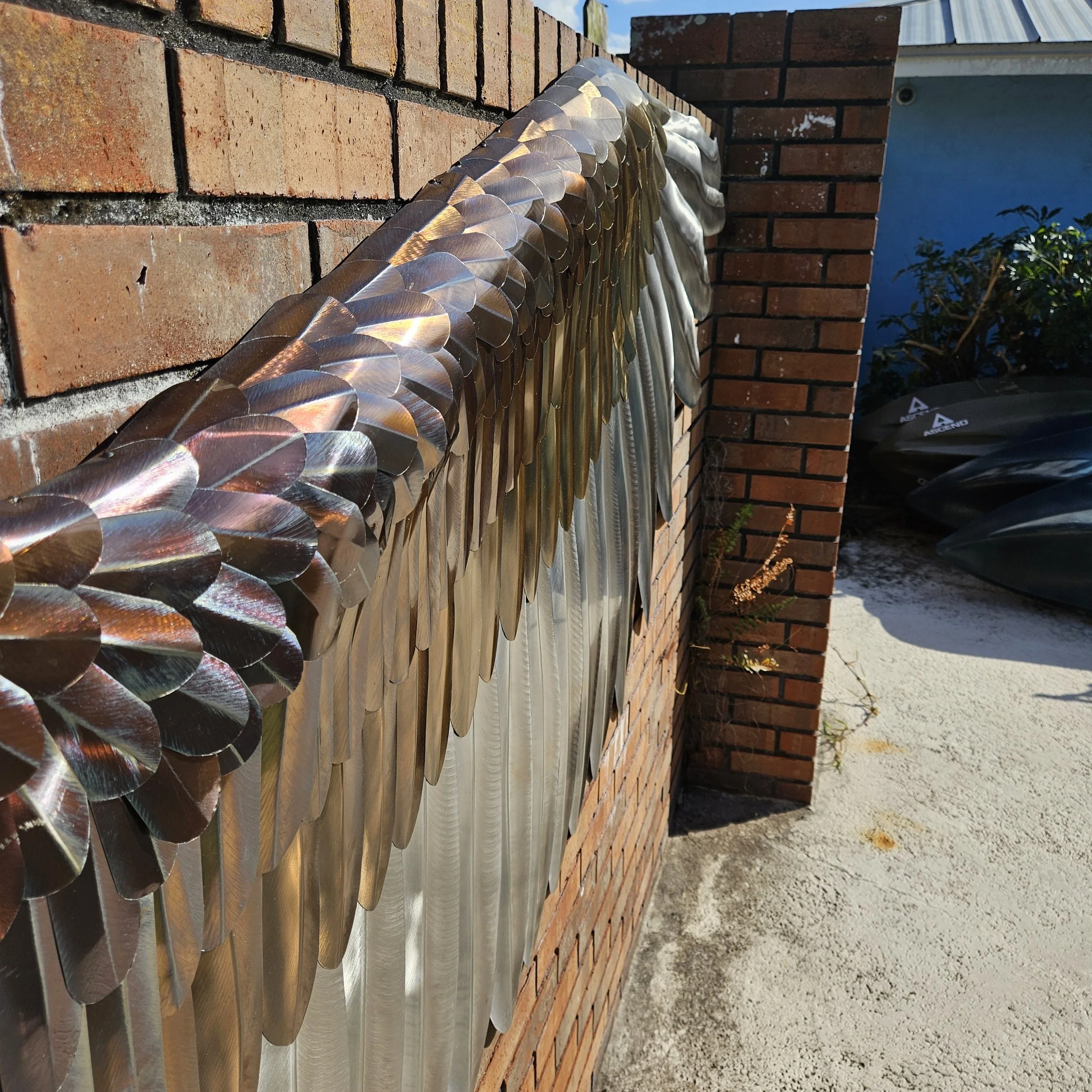 Close-up of the silver and gold feathers