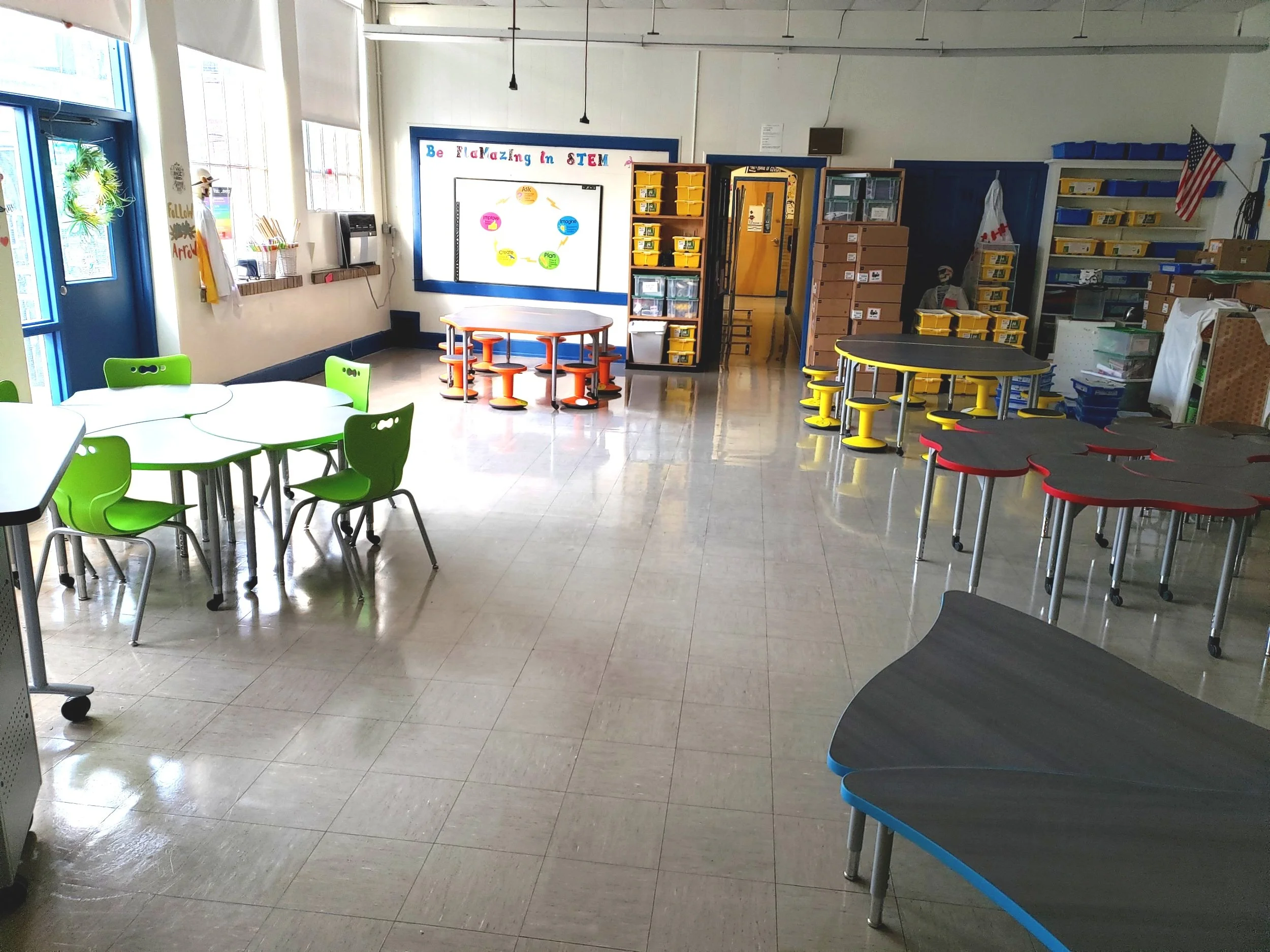 colorful seating around petal like table in classroom