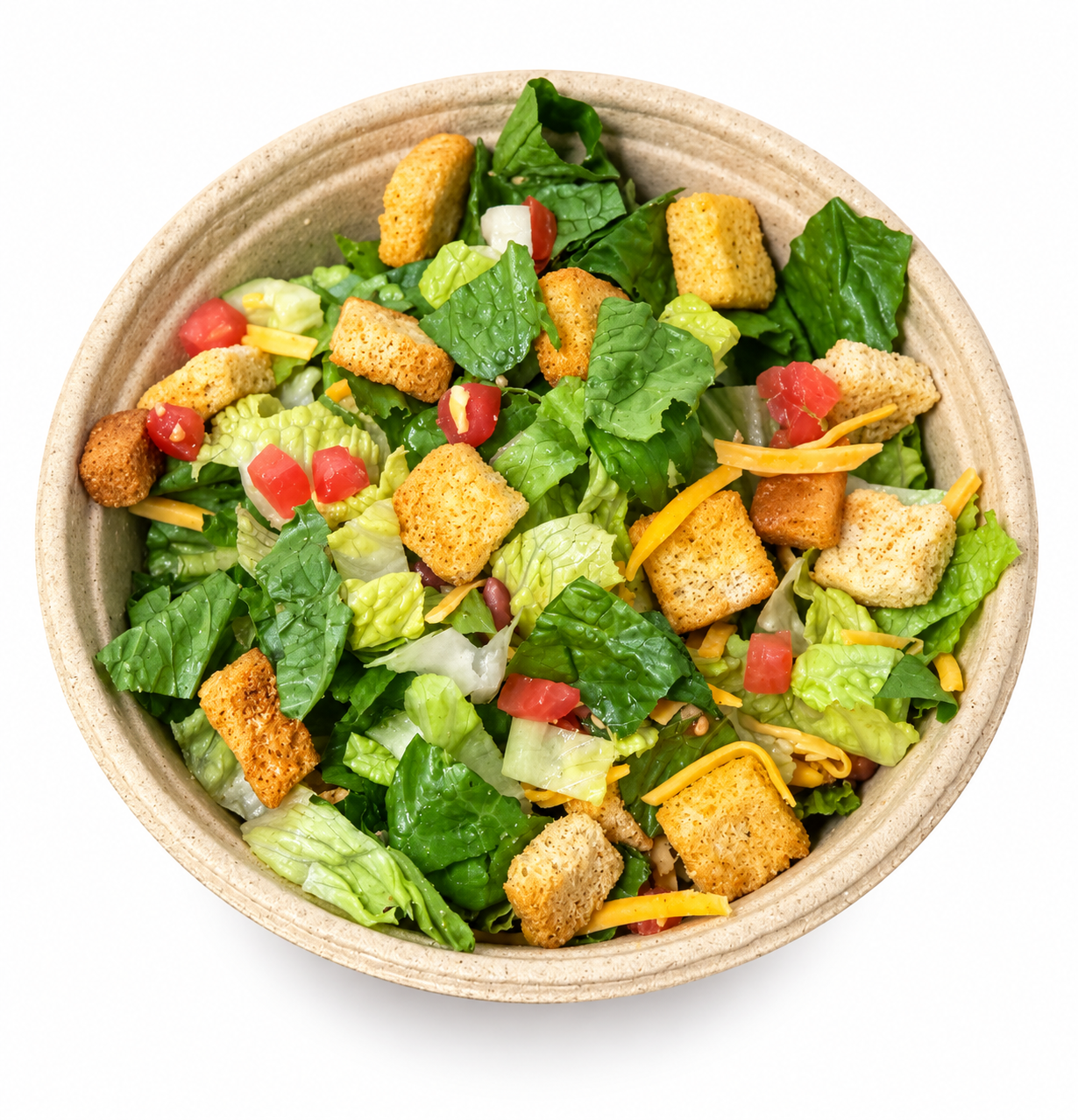 Caesar salad with romaine, croutons, and tomatoes in a compostable Kanbol molded fiber bowl made from corn stover