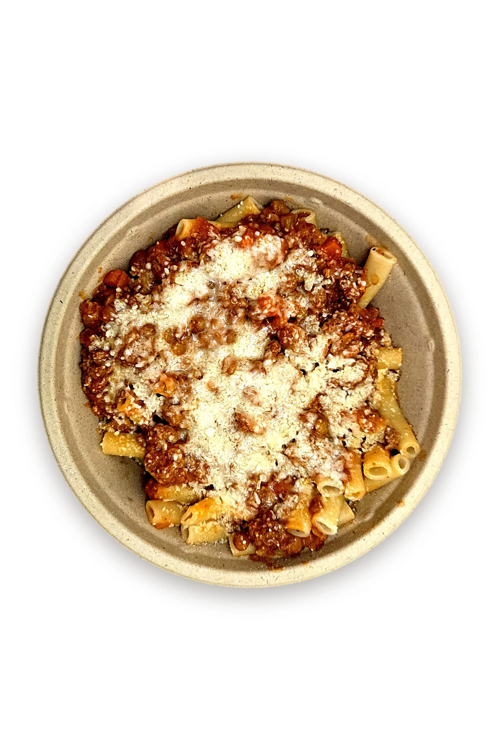 Rigatoni bolognese topped with parmesan in a compostable Kanbol molded fiber bowl made from corn stover