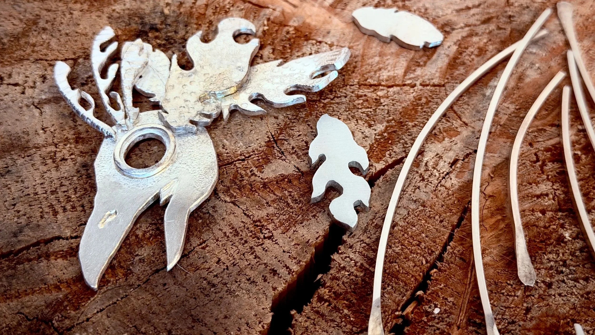 Image of Heidi's Phoenix in progress on a wooden stump