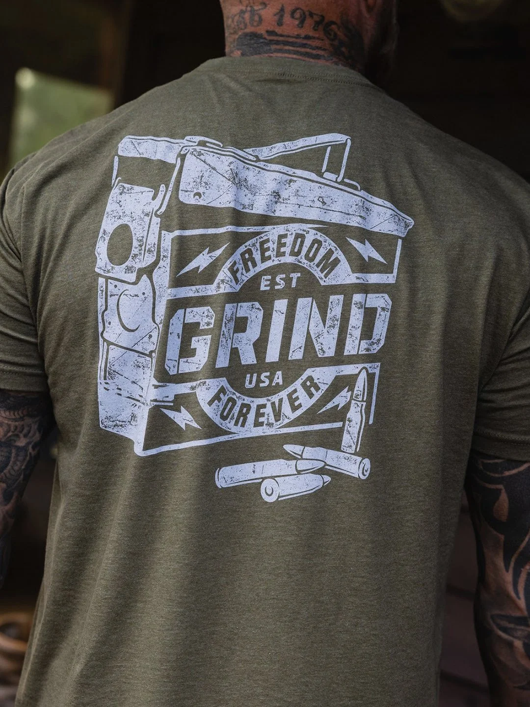 2A apparel graphic featuring ammo can illustration and distressed typography for The Grind Athletics.