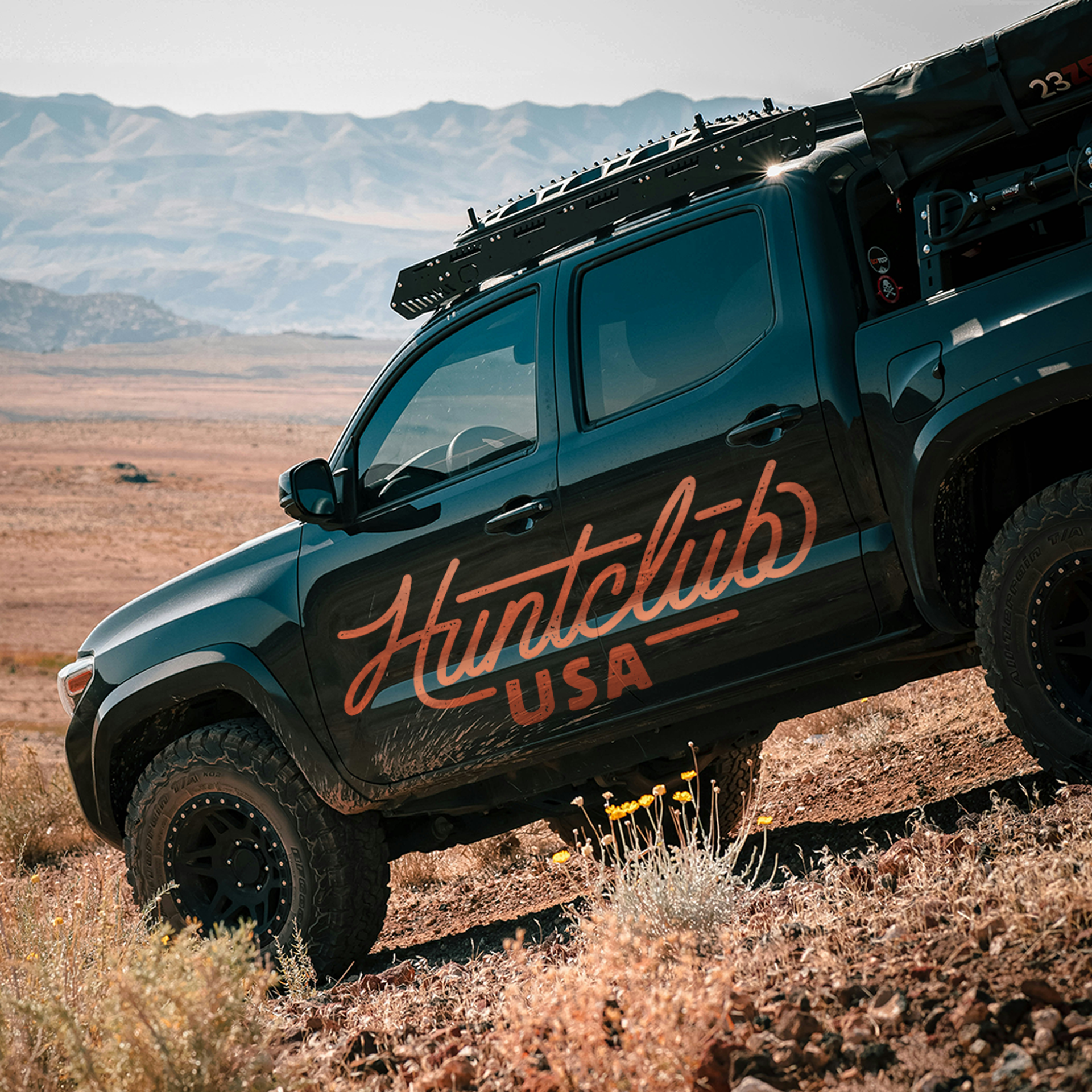 Custom outdoor lifestyle branding for Huntclub USA displayed as large-scale truck graphics for hunting and outdoor applications.