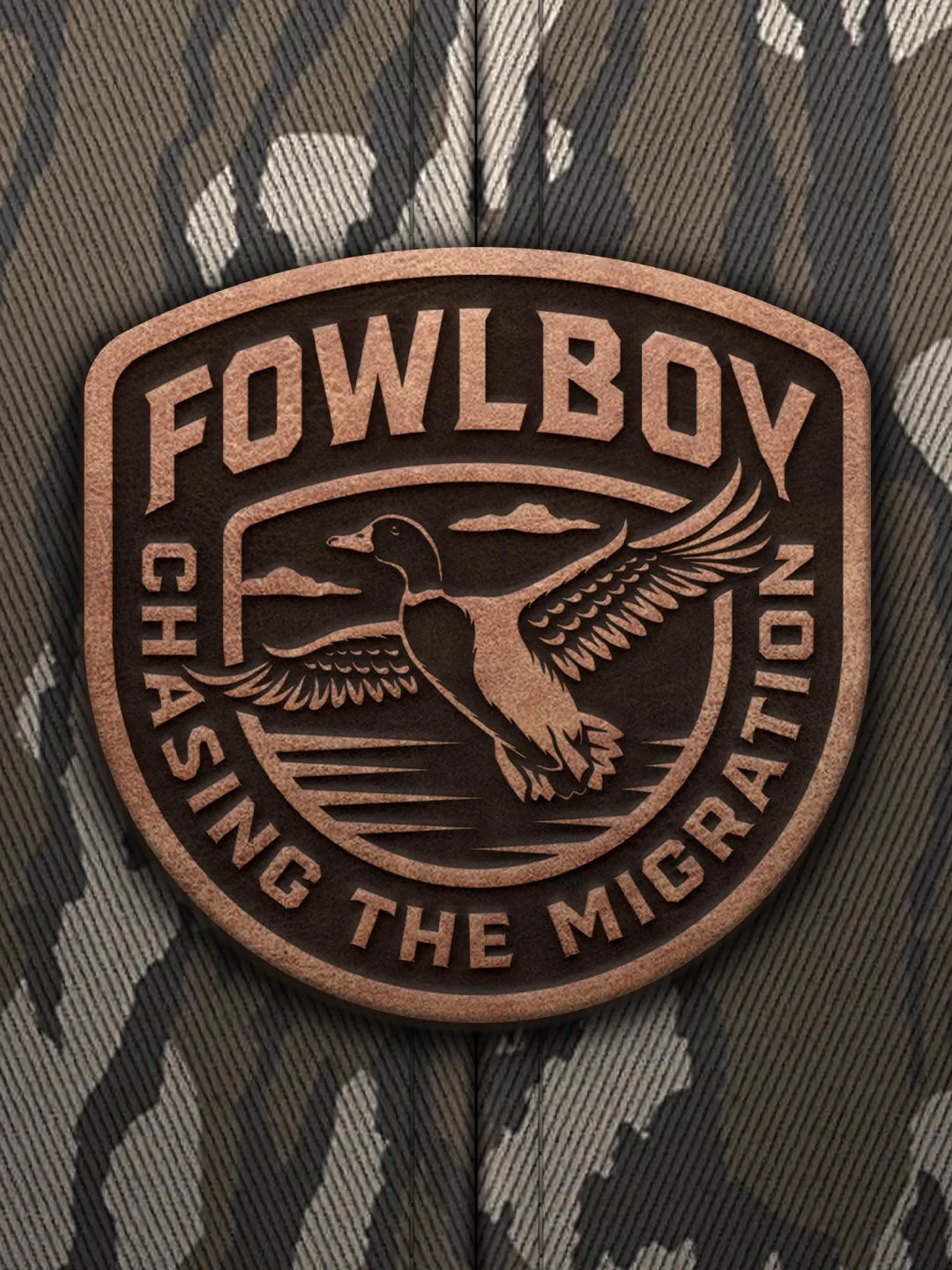 Duck hunting hat patch design featuring a flying waterfowl illustration and badge-style composition for Fowlboy.