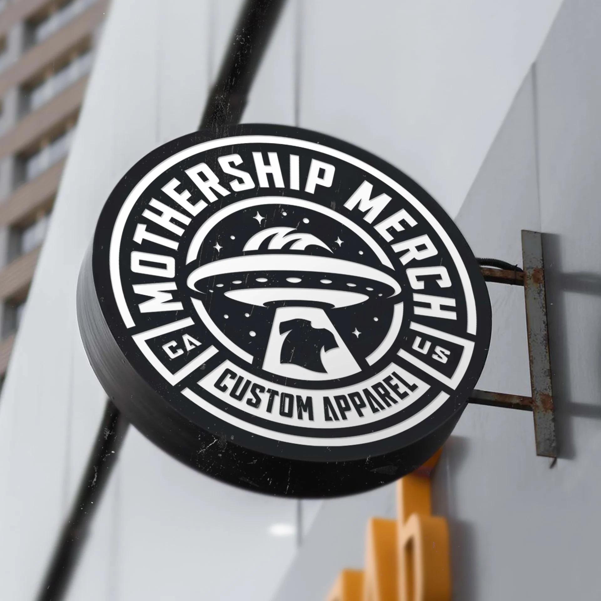 Mothership Merch rebrand logo displayed on circular shop signage
