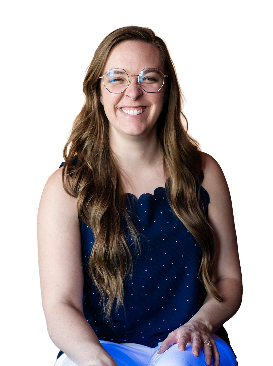 Madigan, founder of CommitmentISM, smiles directly at the camera, conveying warmth, trust, and approachability.