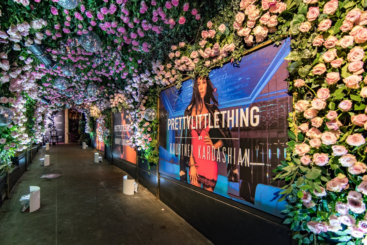 PrettyLittleThing PLT X Kourtney Kardashian Collection Celebrity Launch Party KKs picture in the tunnel of flowers.jpg
