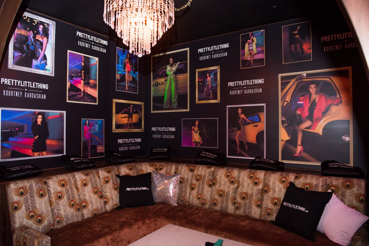 PrettyLittleThing PLT X Kourtney Kardashian Collection Celebrity Launch Party VIP area with posters.jpg