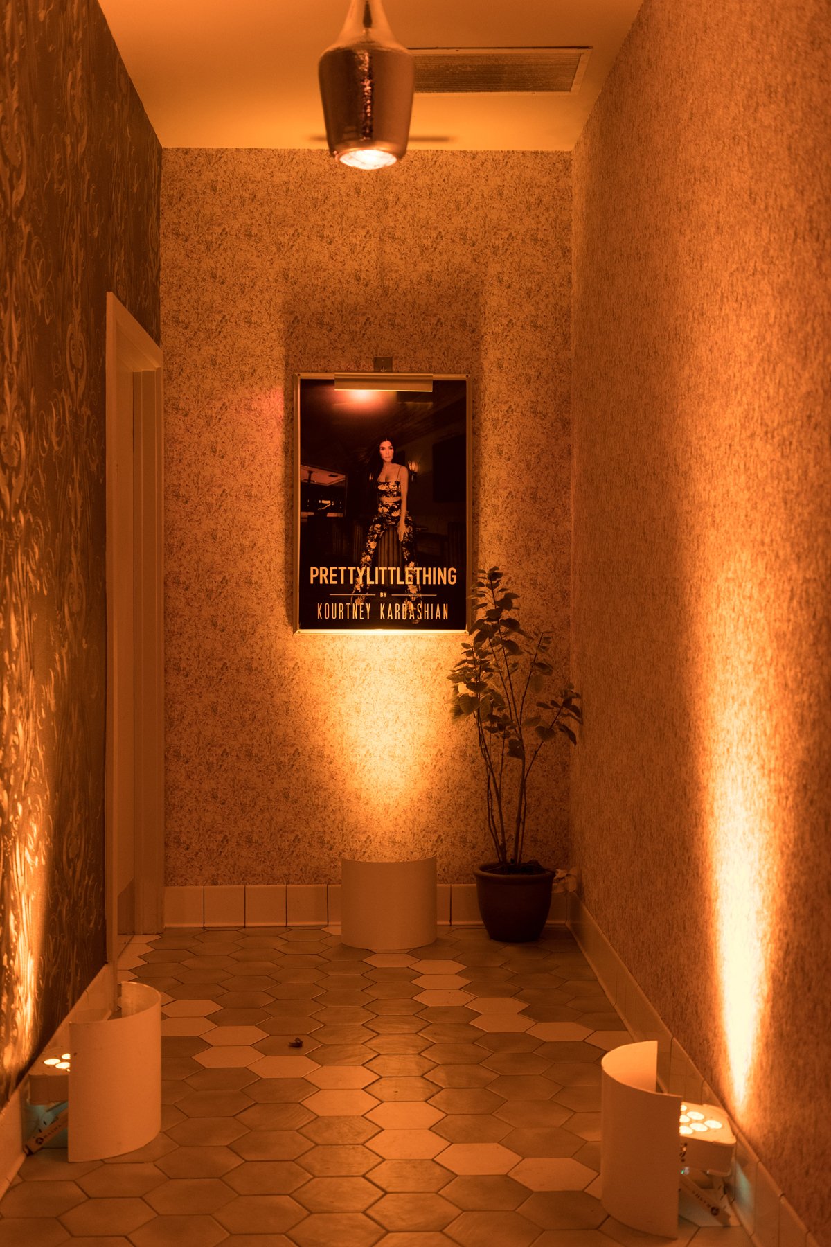 PrettyLittleThing PLT X Kourtney Kardashian Collection Celebrity Launch Party even the restroom entrance was decorated.jpg