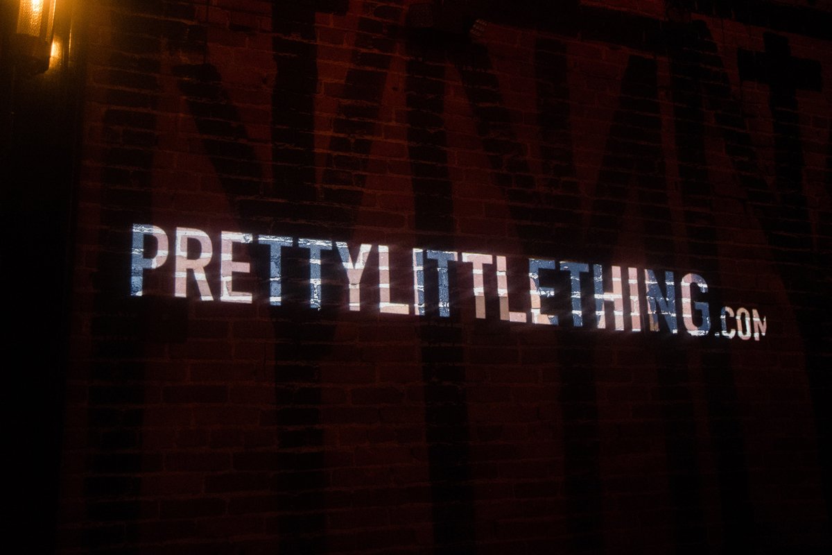 PrettyLittleThing PLT X Olivia Culpo Collection  Celebrity Launch Party logo on the wall.jpg