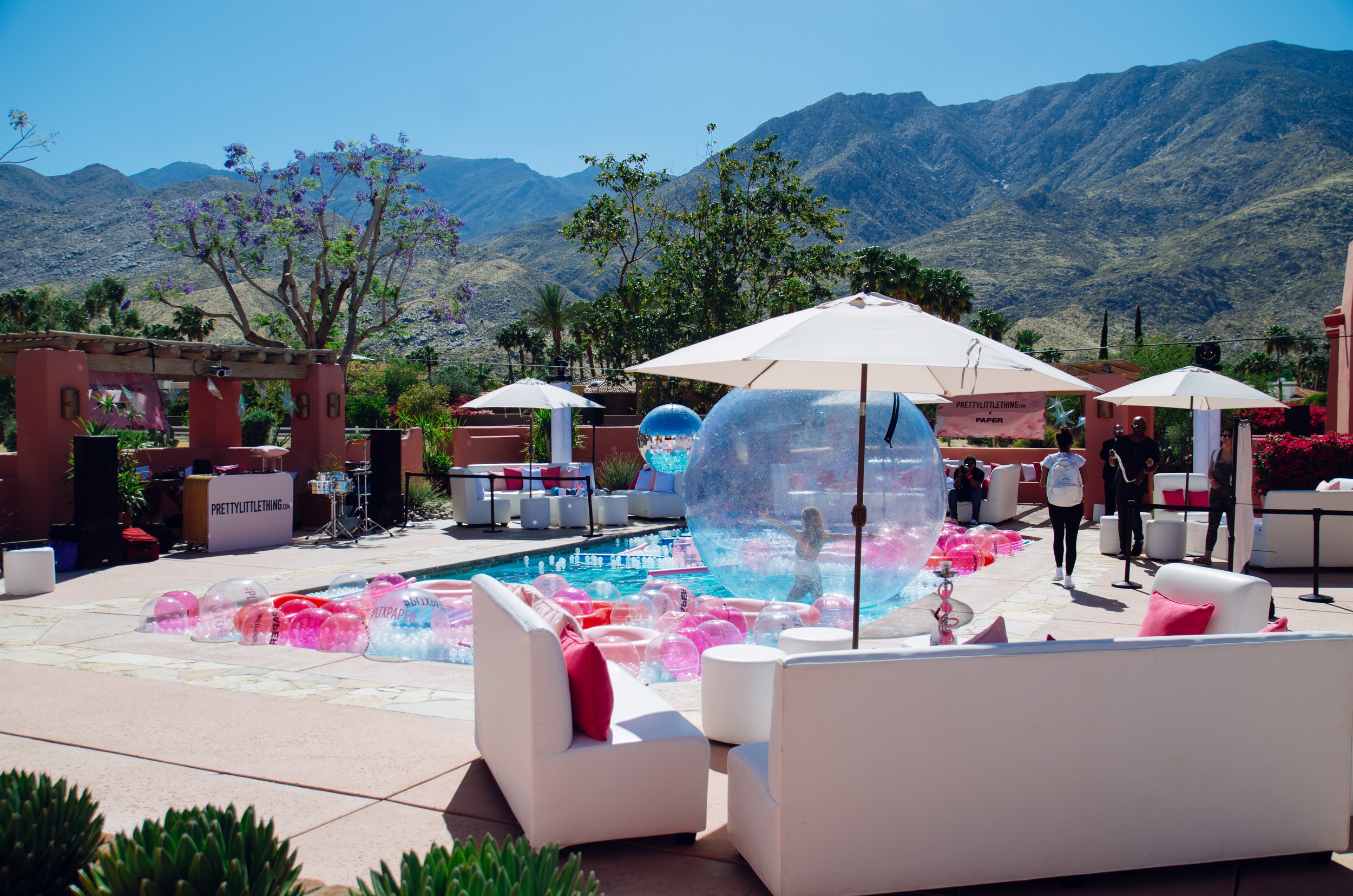 Ultimate Hollywood Coachella Poolside Party pink beach balls fill the pool.jpg