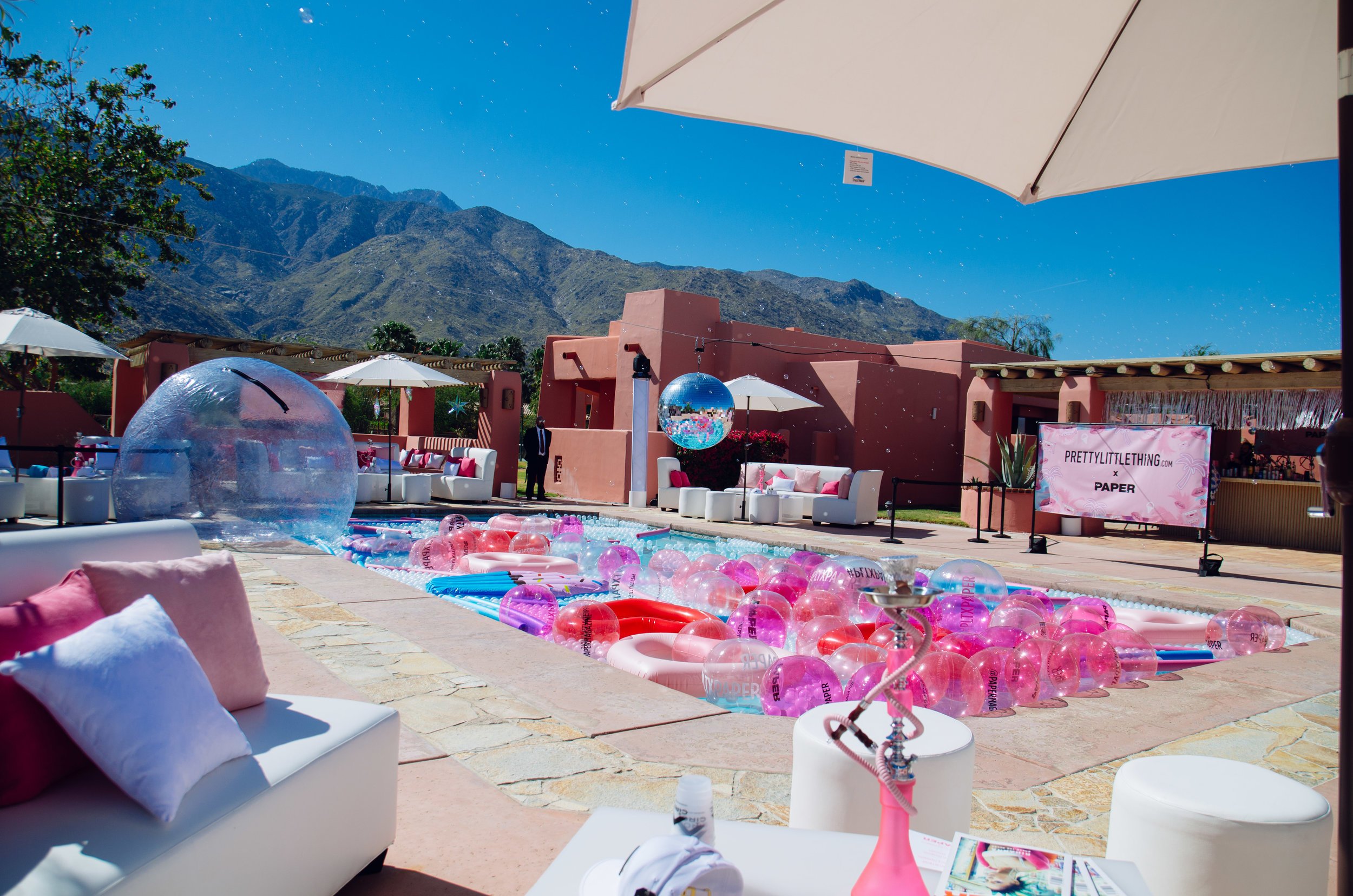 Ultimate Hollywood Coachella Poolside Party pink beach balls in the pool.jpg