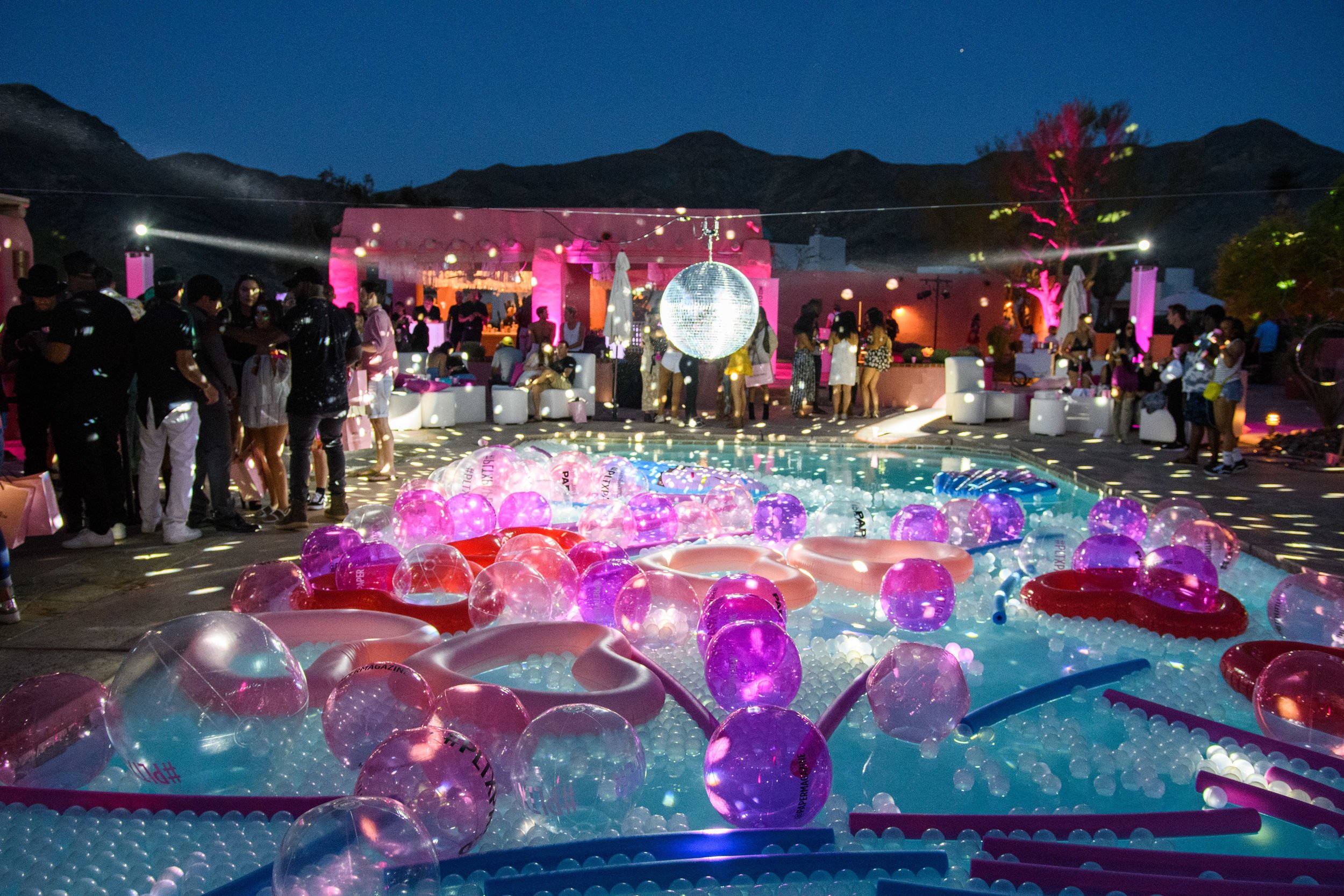 Ultimate Hollywood Coachella Poolside Party disco ball spins above the pool.jpg