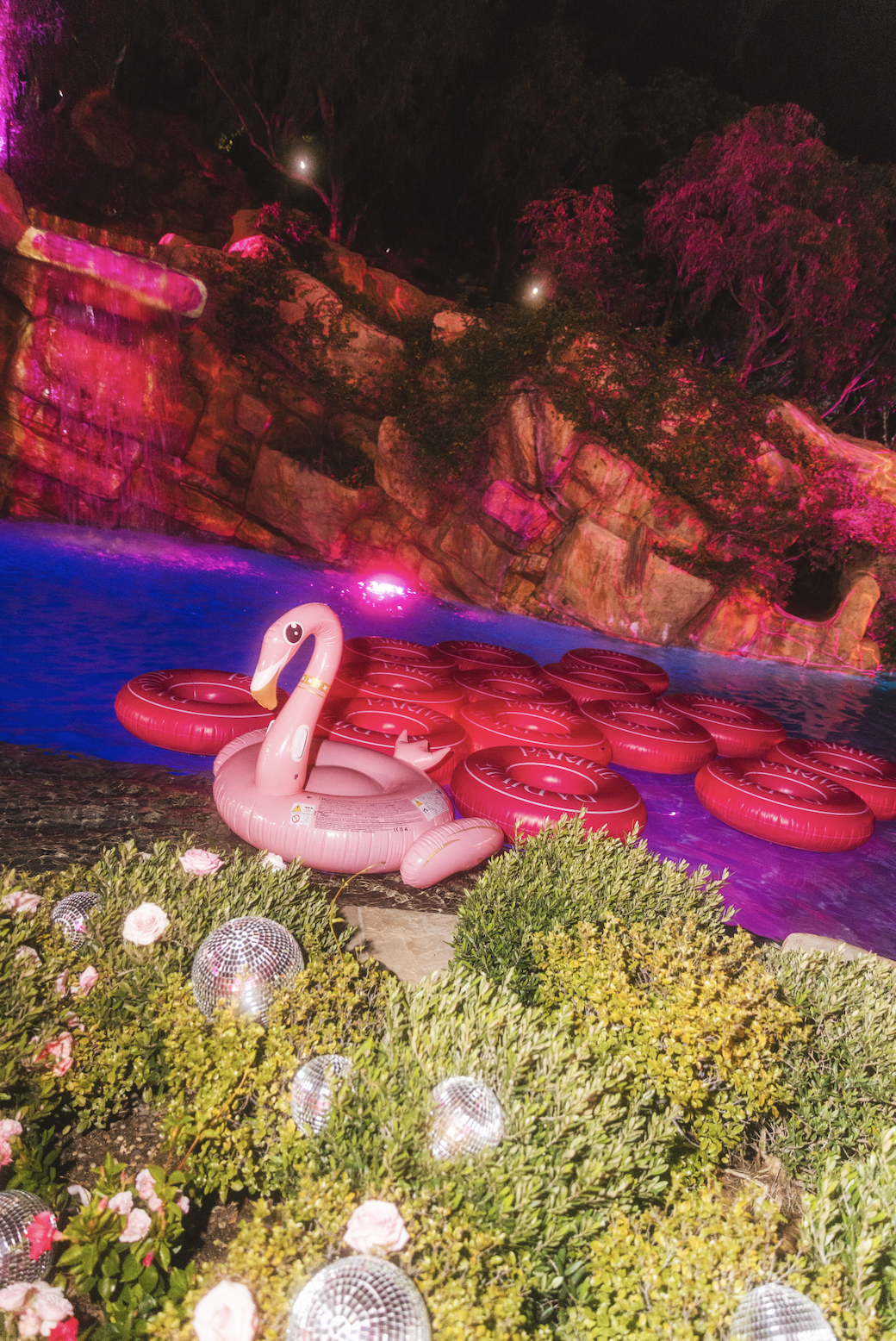 Custom pink pool floats and glamorous Barbiecore pool styling designed by Loriann Serna of The Wife of the Party for Paris Hilton’s luxury birthday celebration.