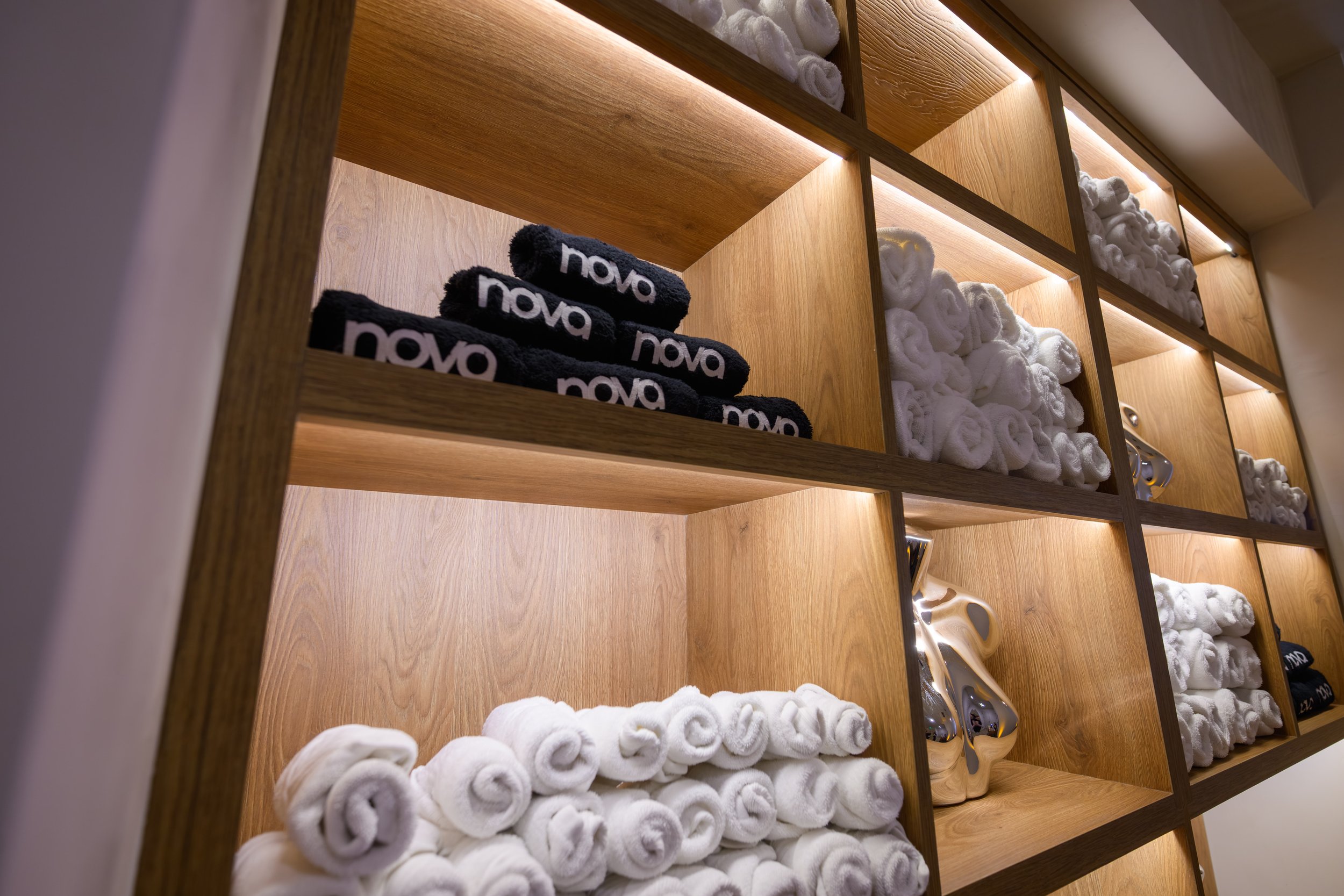 Nova Fitness branded accessories inside personalized influencer locker including fitness gear and wellness essentials at Fashion Nova event produced by Wife of the Party