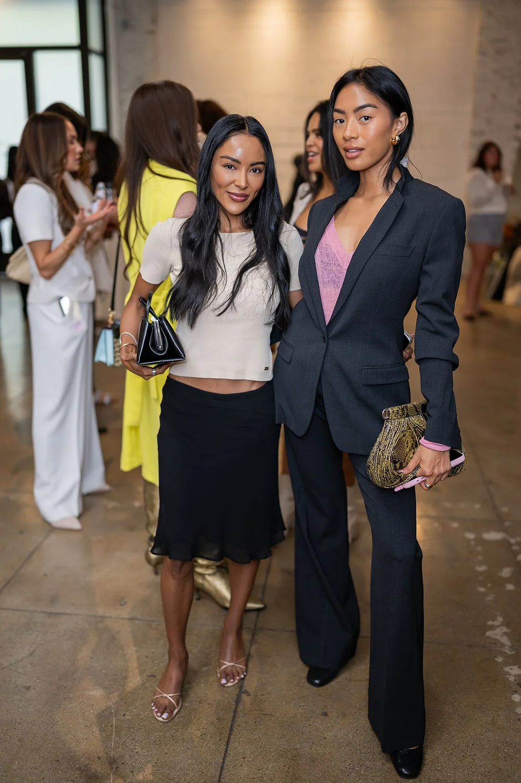 Stylish guests attending OneSkin influencer event in modern fashion at brand experience