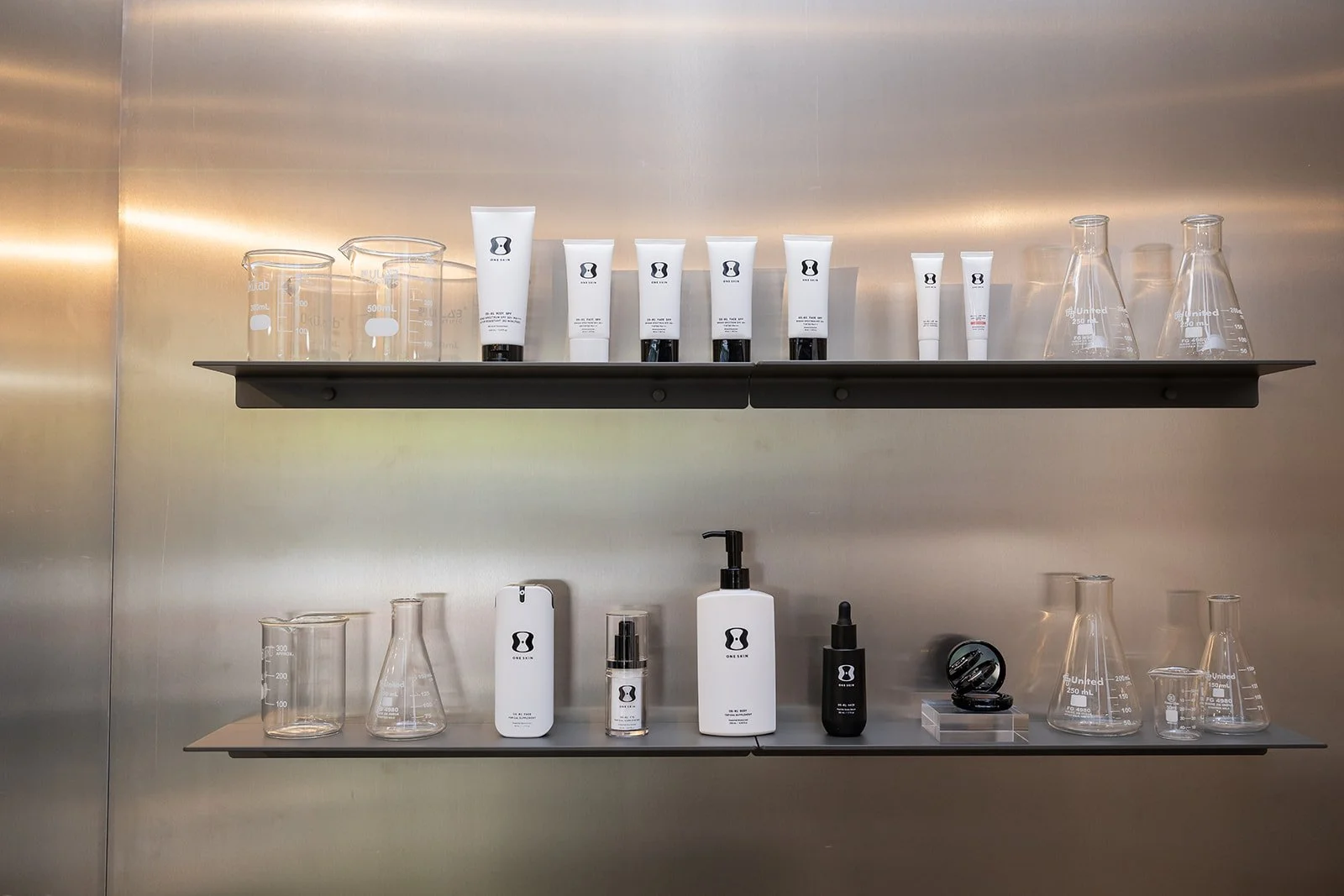 OneSkin product education display showcasing skincare benefits at influencer brand event