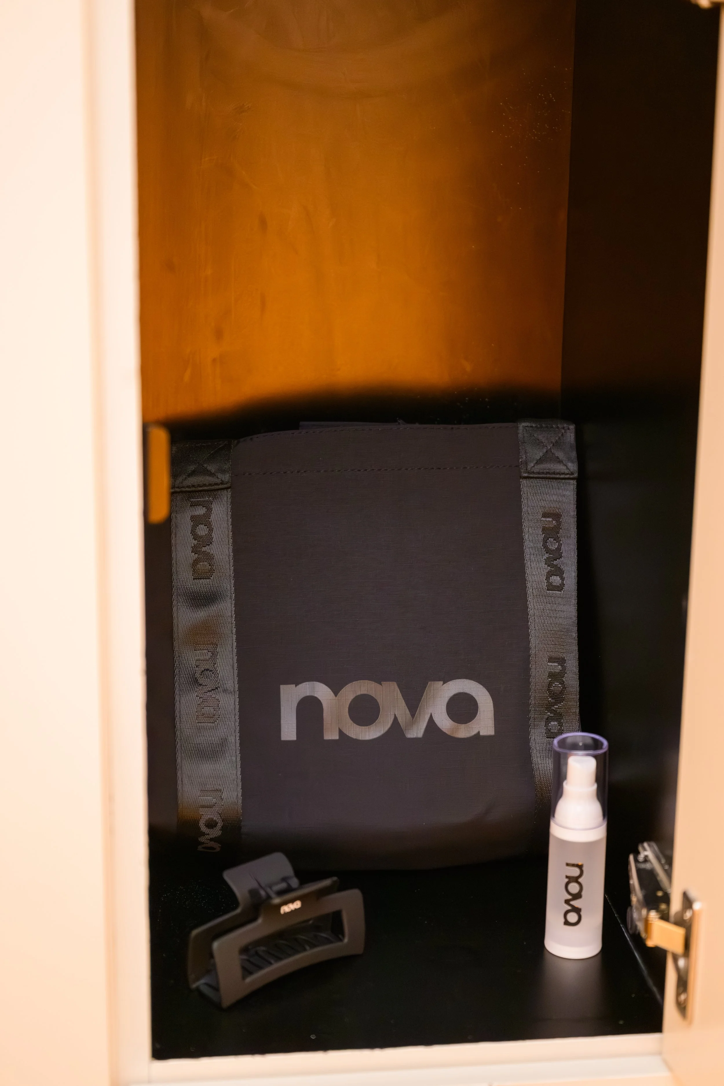Nova Fitness branded accessories inside personalized influencer locker including fitness gear and wellness essentials at Fashion Nova event produced by Wife of the Party